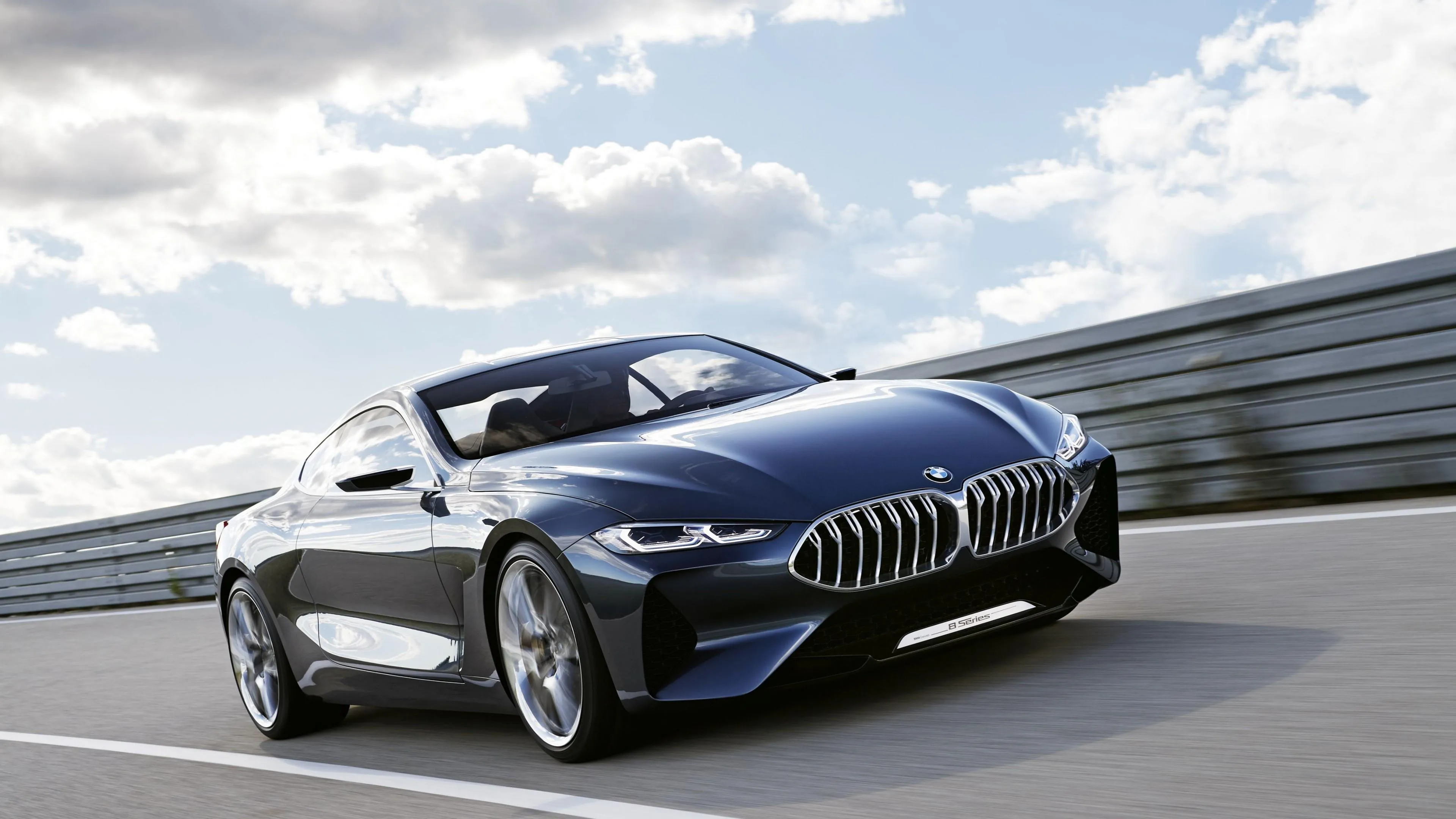 Convertible Bmw Driving on Highway Under Blue Sky Image