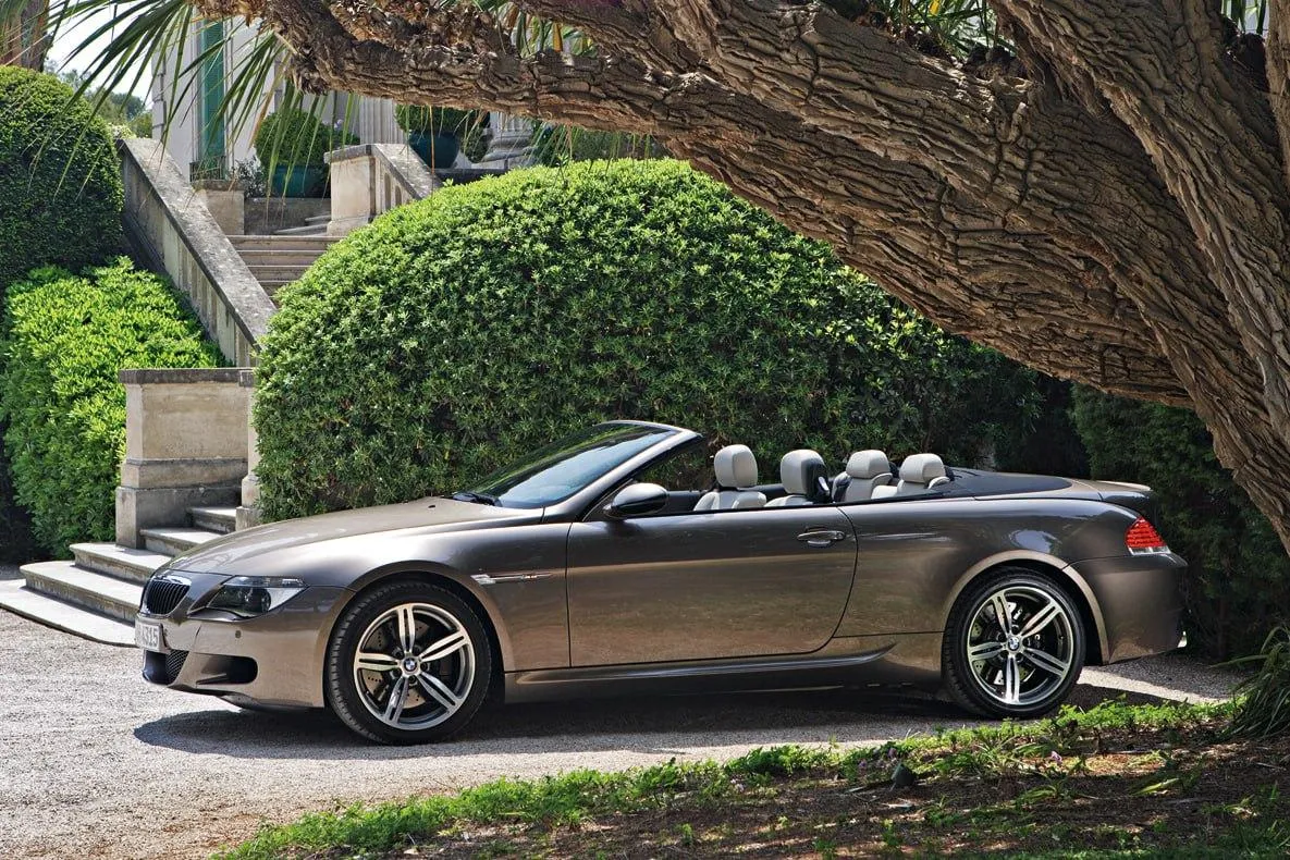 Convertible Bmw Parked in Front of a Garden Sidewalk