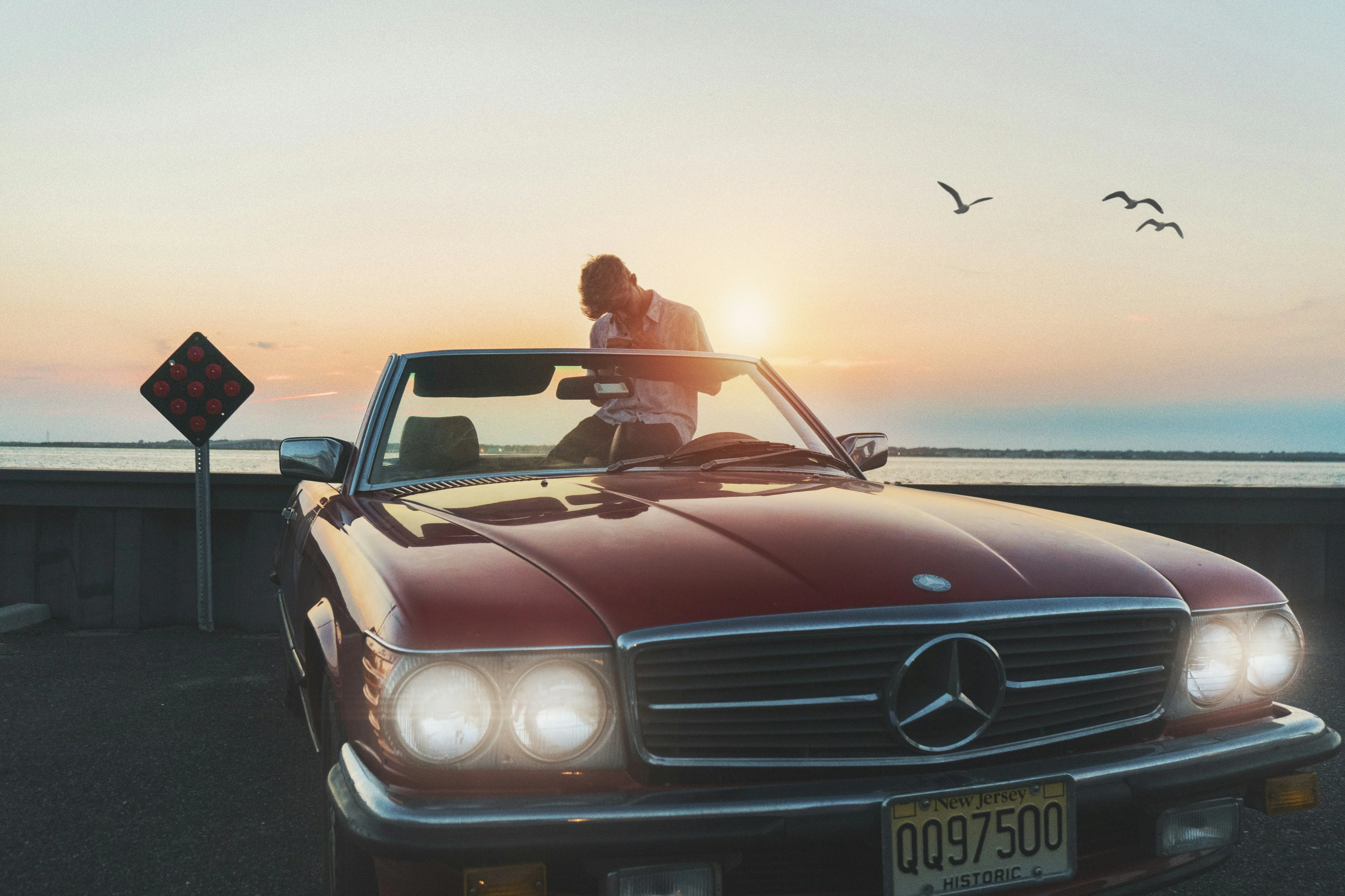 Convertible Mercedes Benz with beautiful Beach Sunset View