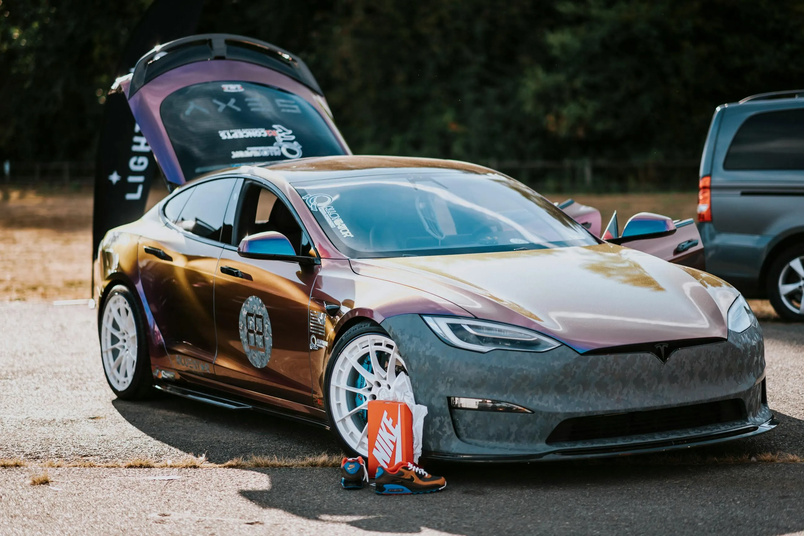 Custom Wrapped Tesla with back door Open HD wallpaper Image