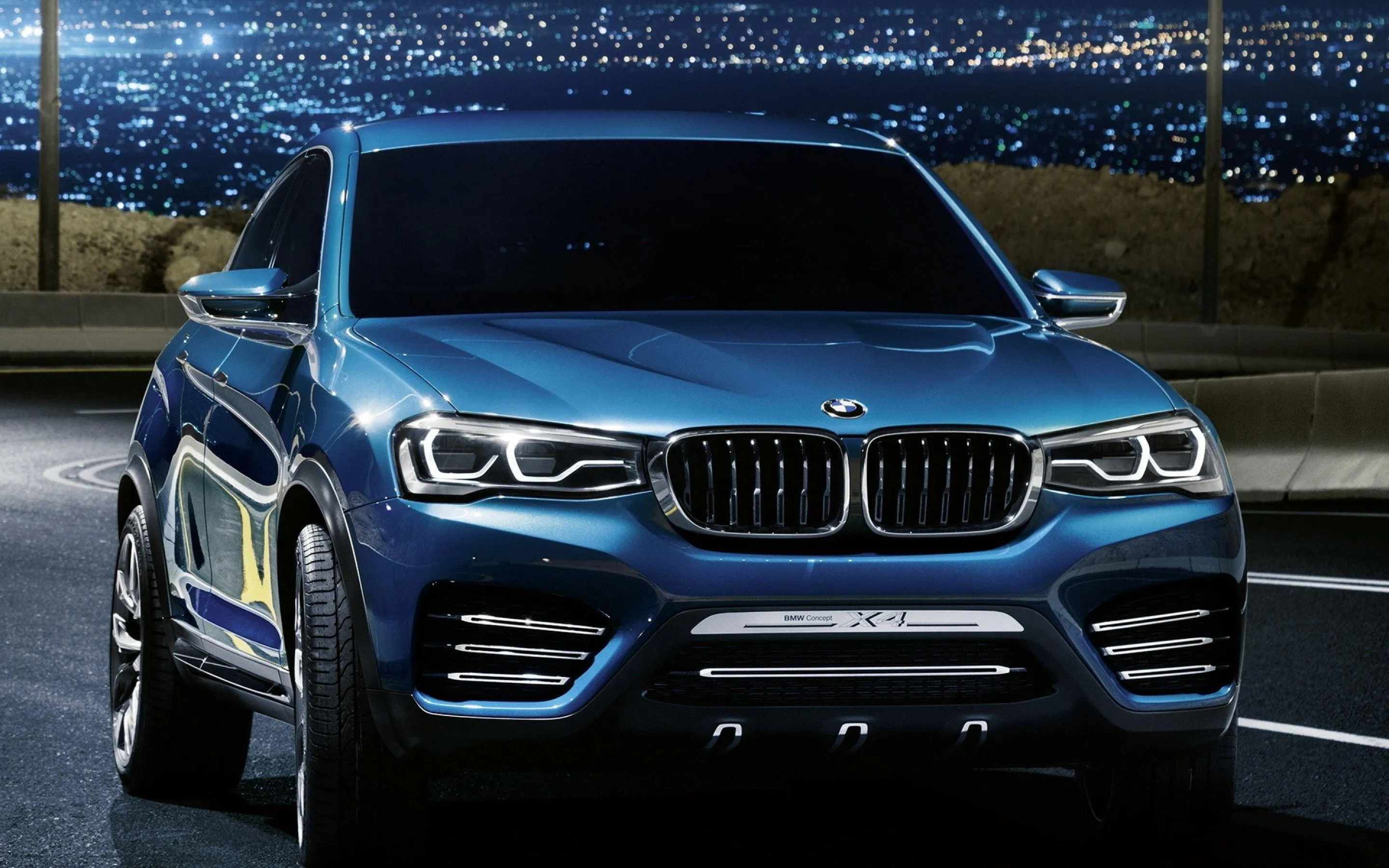 Dark Blue Bmw Suv with City Lights in Background Wallpaper
