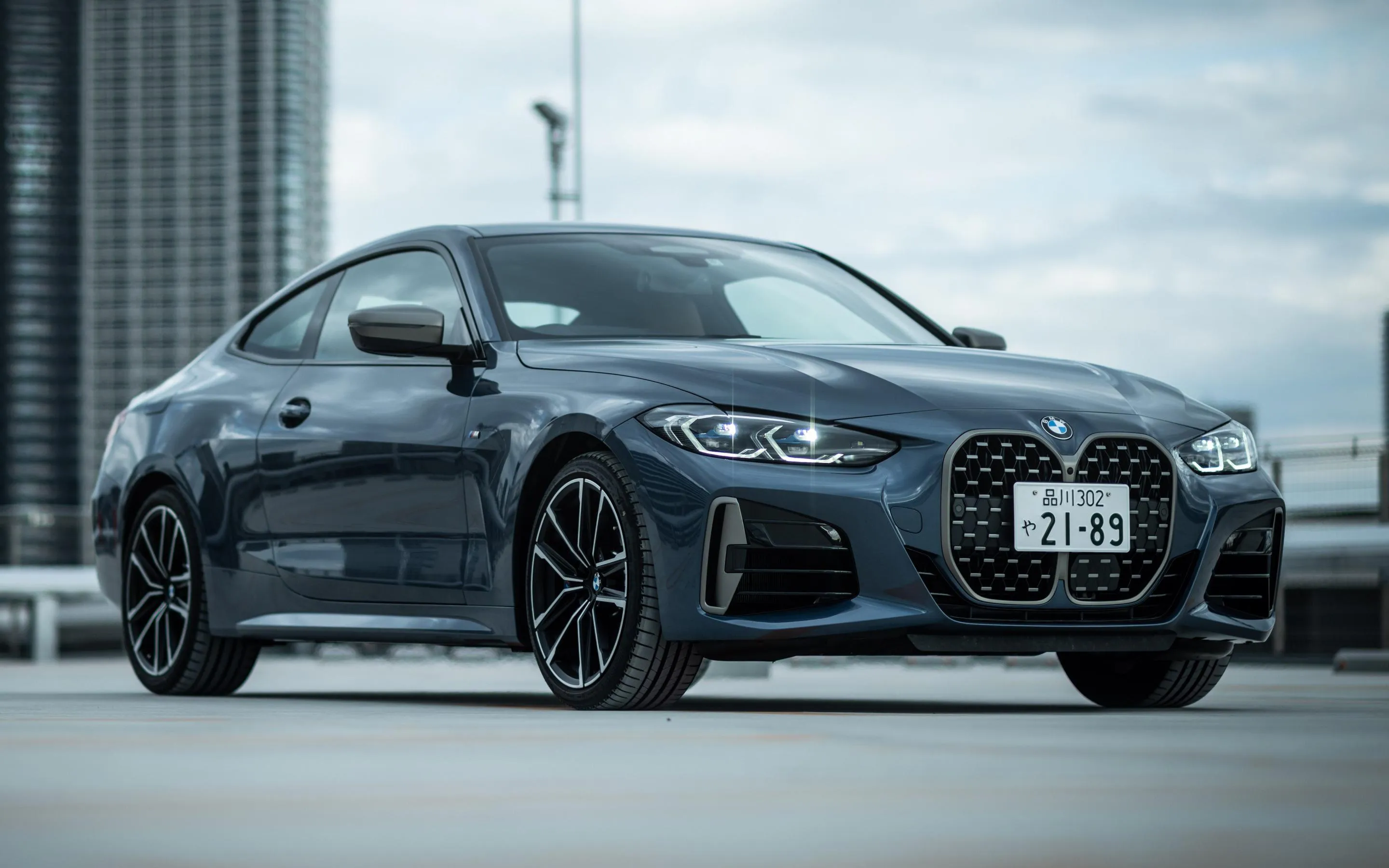 Dark Bmw Car Parked in Modern City Environment Image
