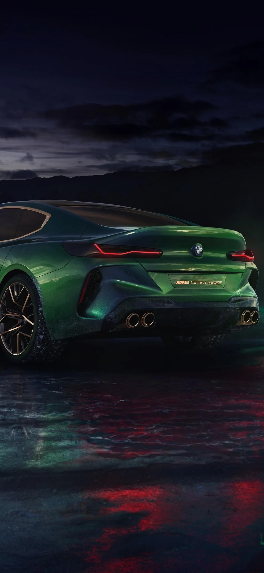 Dark Green Bmw Sports Car Glowing on Wet Neon Street