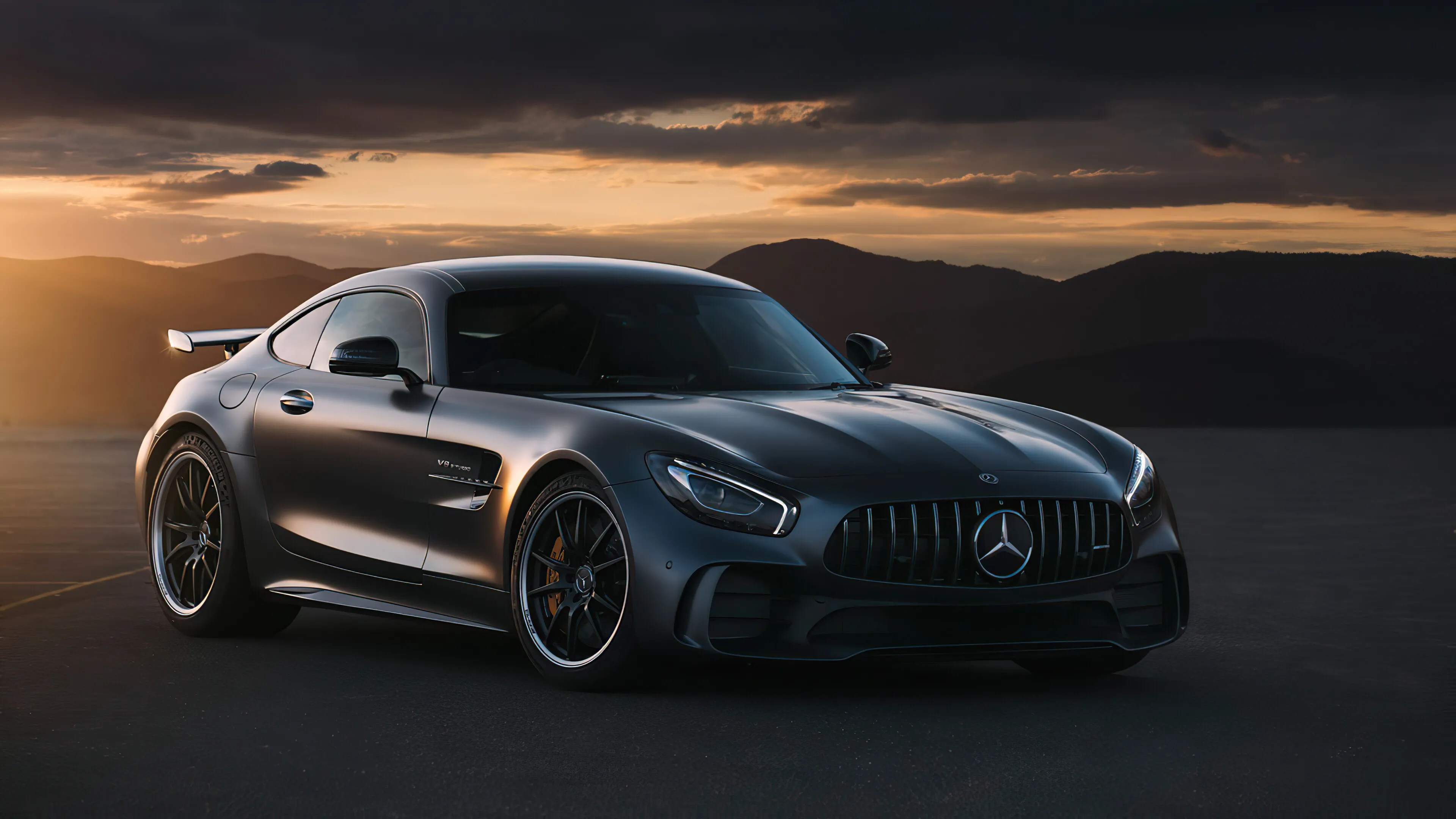 Dark Mercedes Benz AMG Coupe Driving at Golden Sunset
