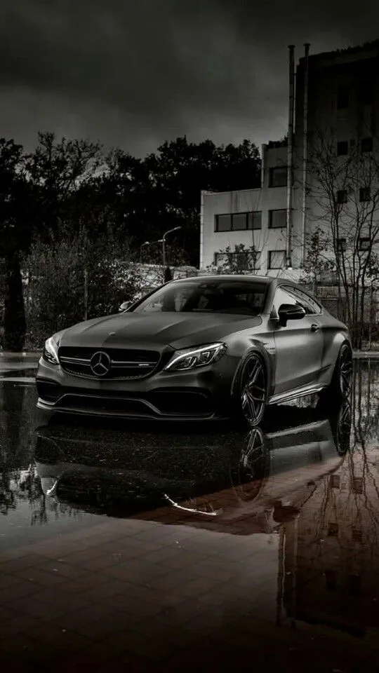 Dark Mercedes Benz on Wet Urban Street at Night Wallpaper