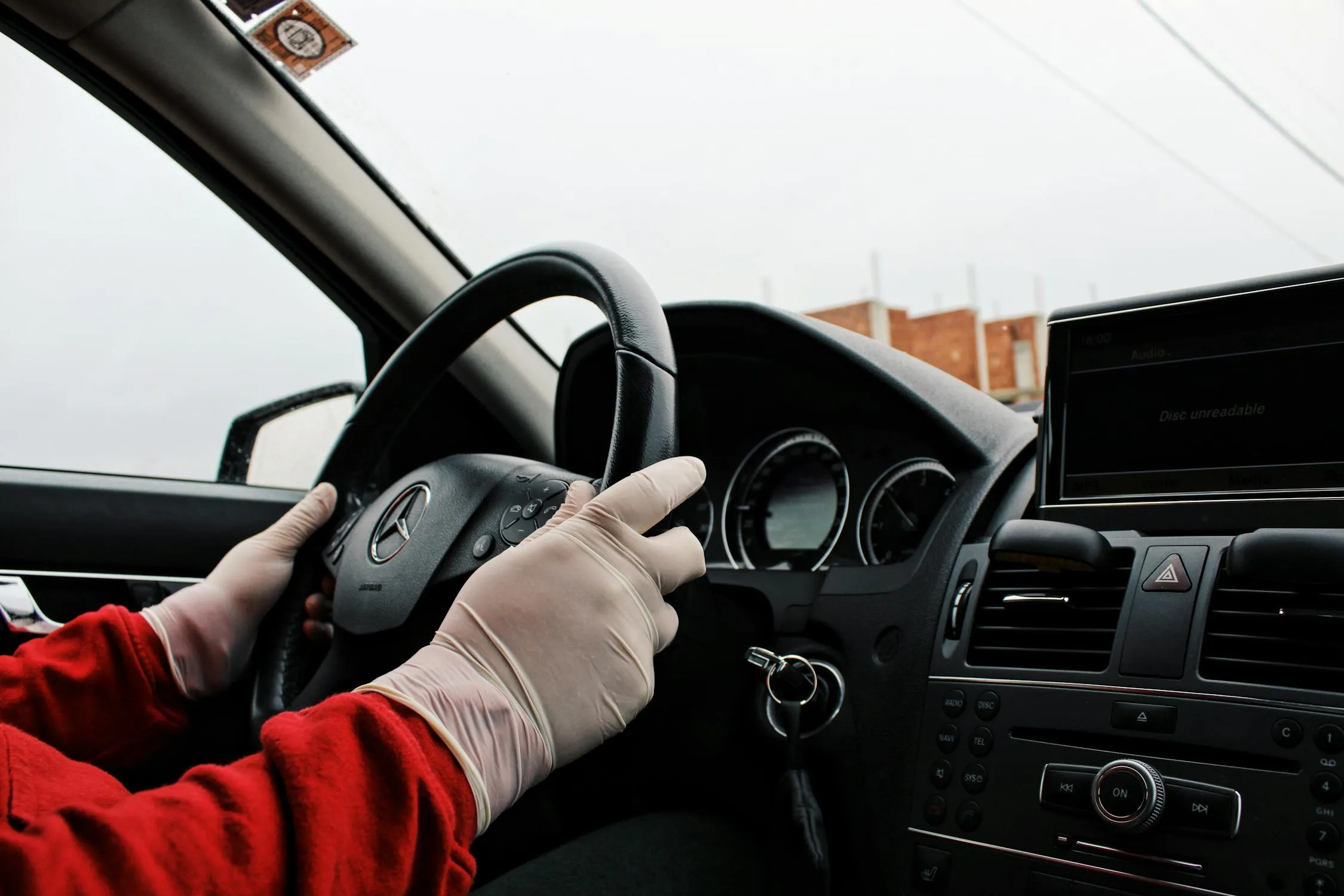 Driver Hands on Steering Wheel Inside Mercedes Benz image