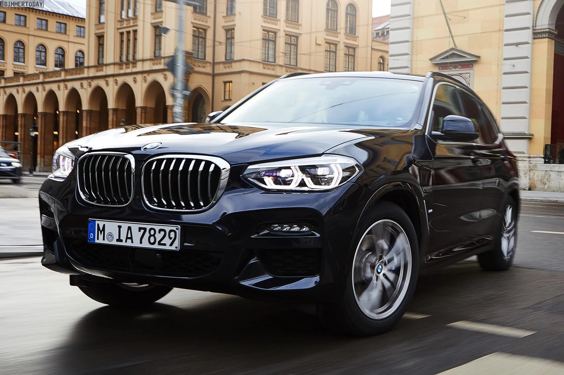 Elegant Black Bmw Suv Parked in Front of Classic Architecture