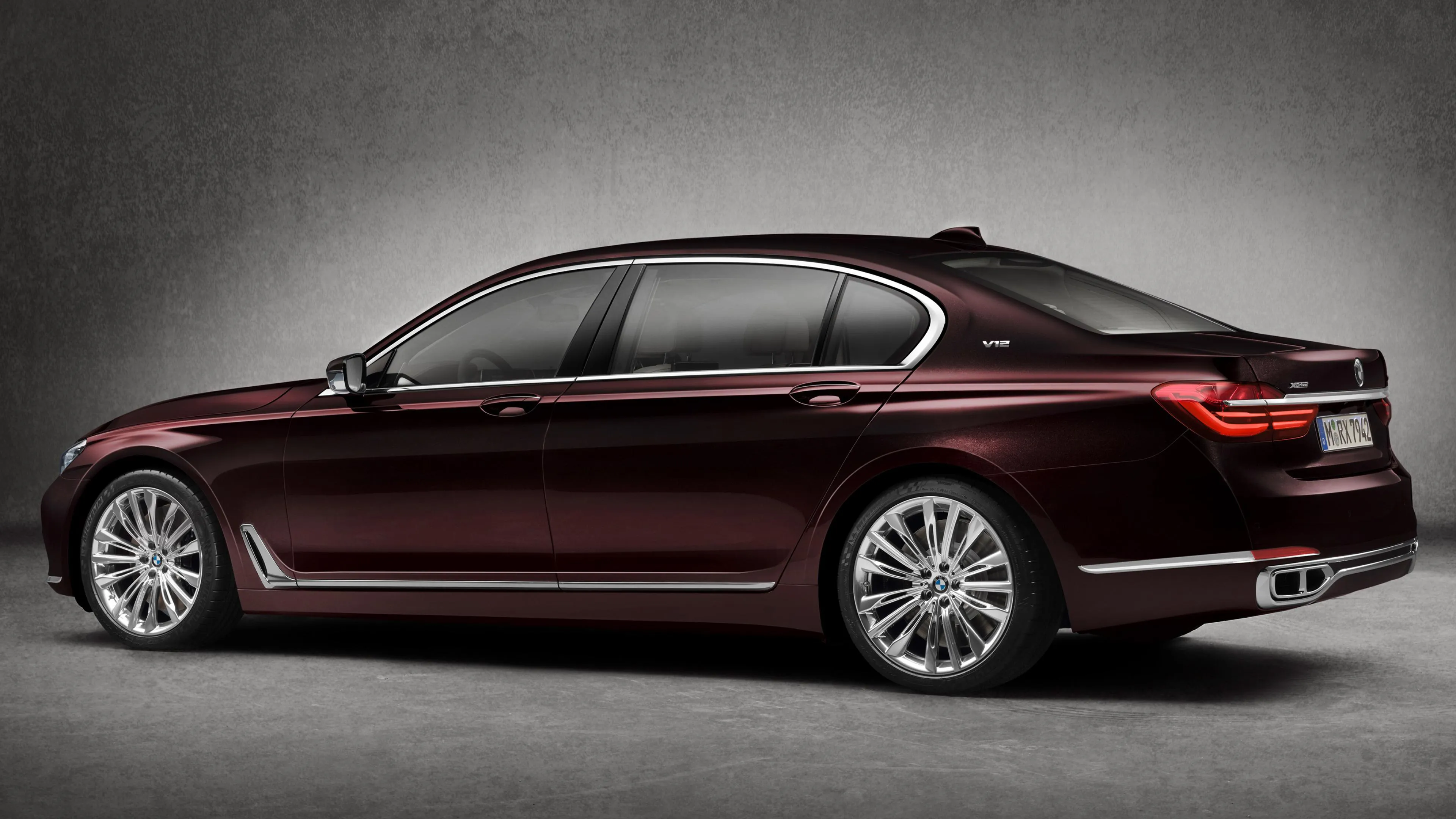 Elegant Dark Red Bmw Sedan Shown in Side Profile View