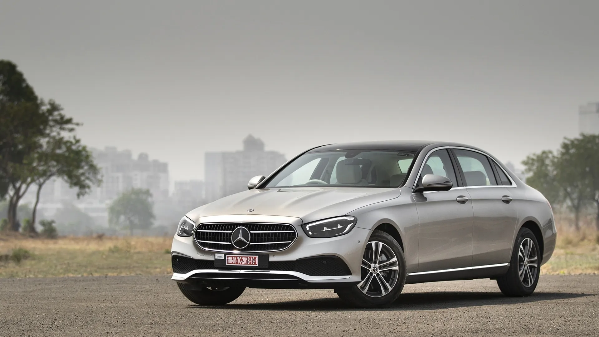 Elegant Mercedes Benz Sedan Posed in Urban Landscape