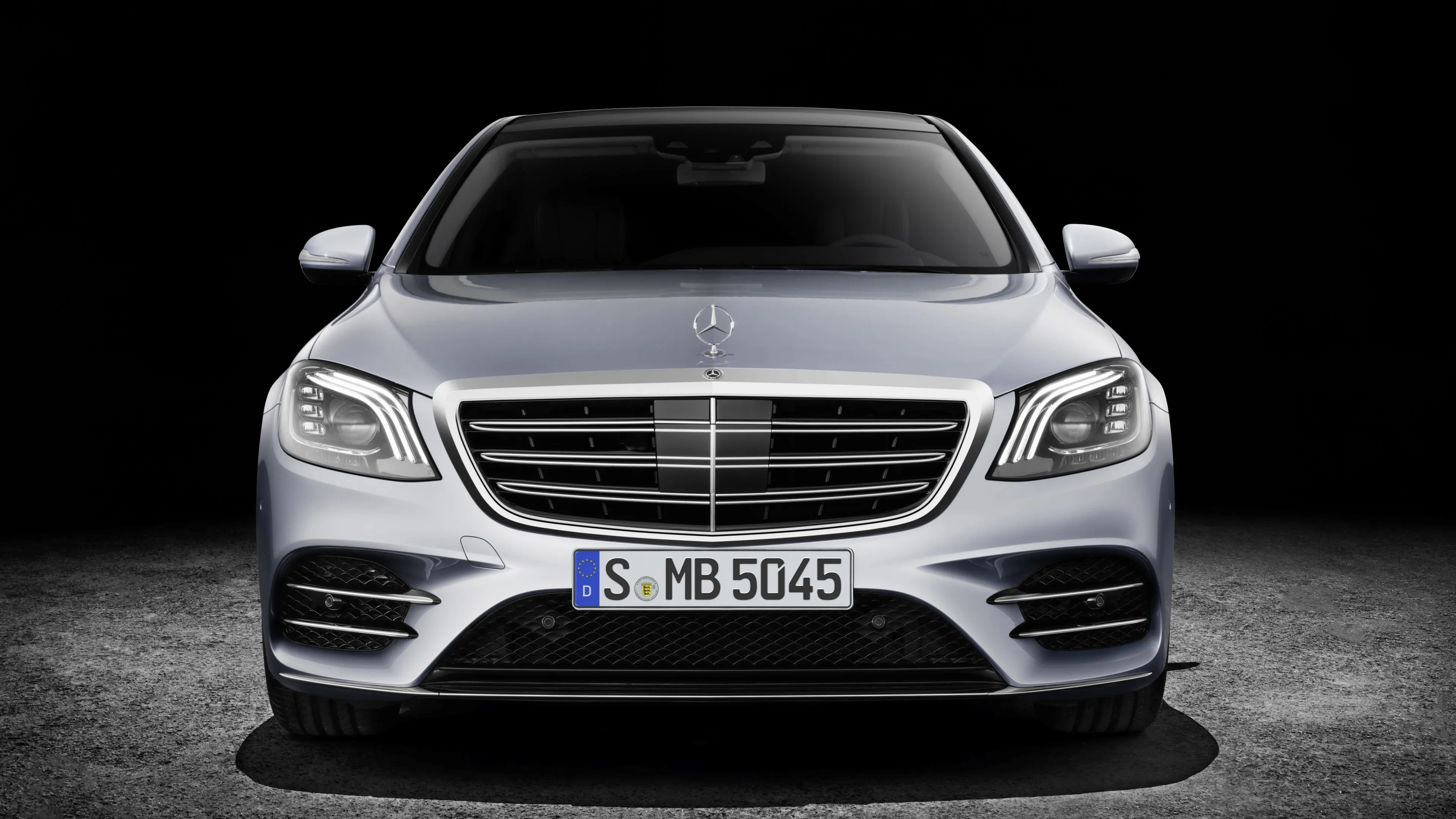 Front Facing Silver Mercedes Benz in Studio with Lights