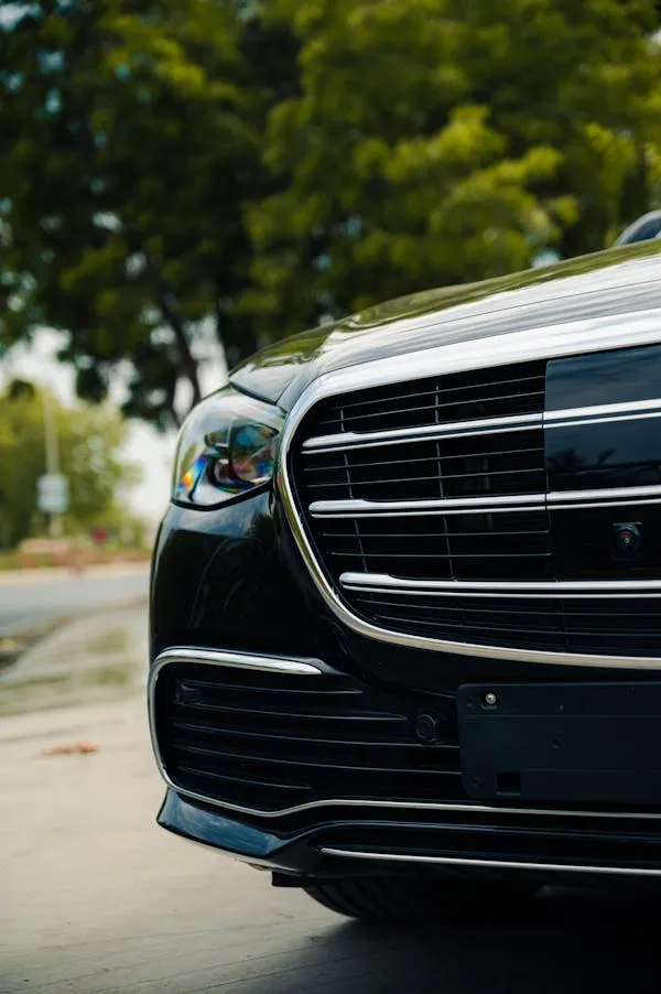 Front grille of a modern black Mercedes car close up