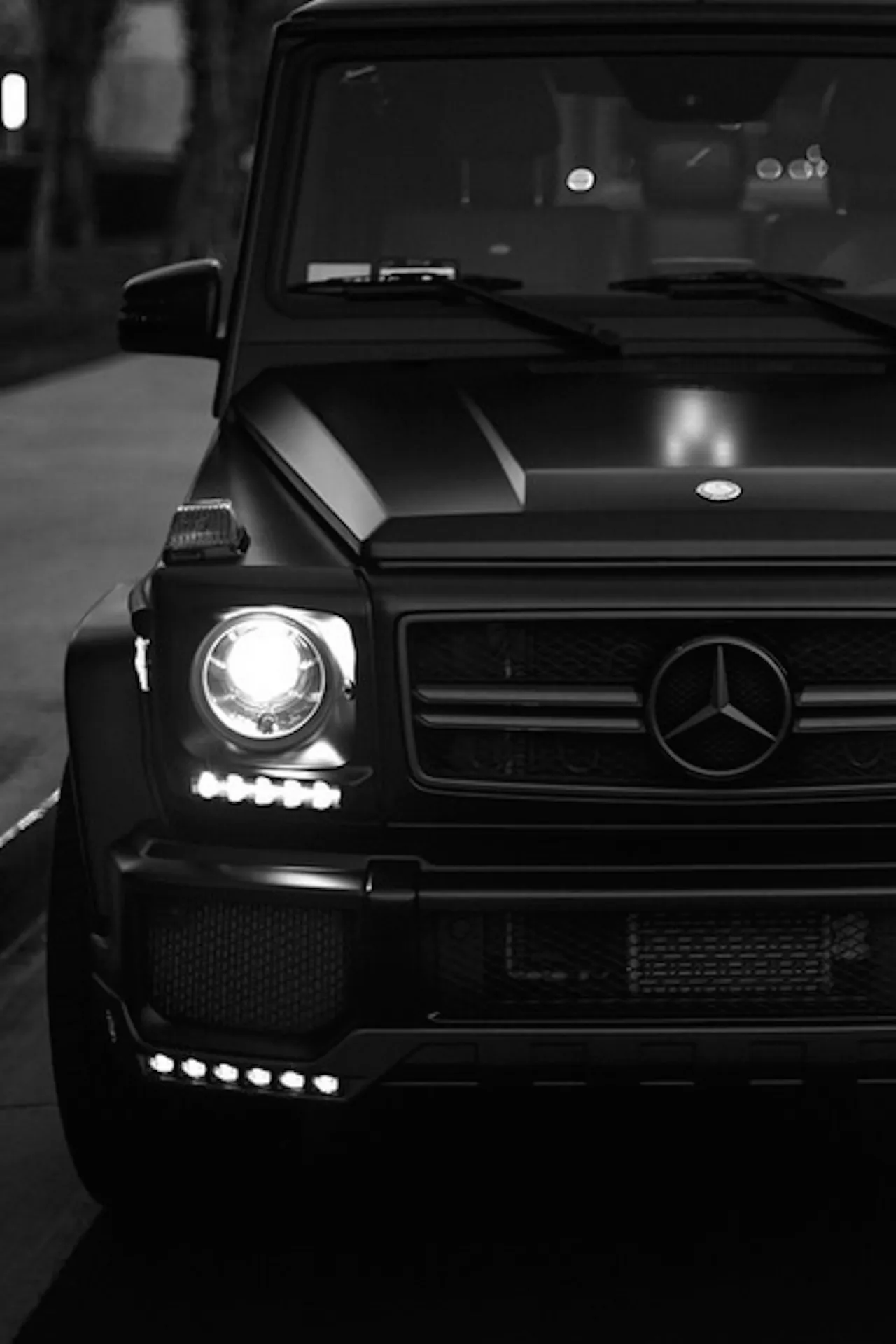 Front View Black Mercedes Benz SUV with Lights On Wallpaper