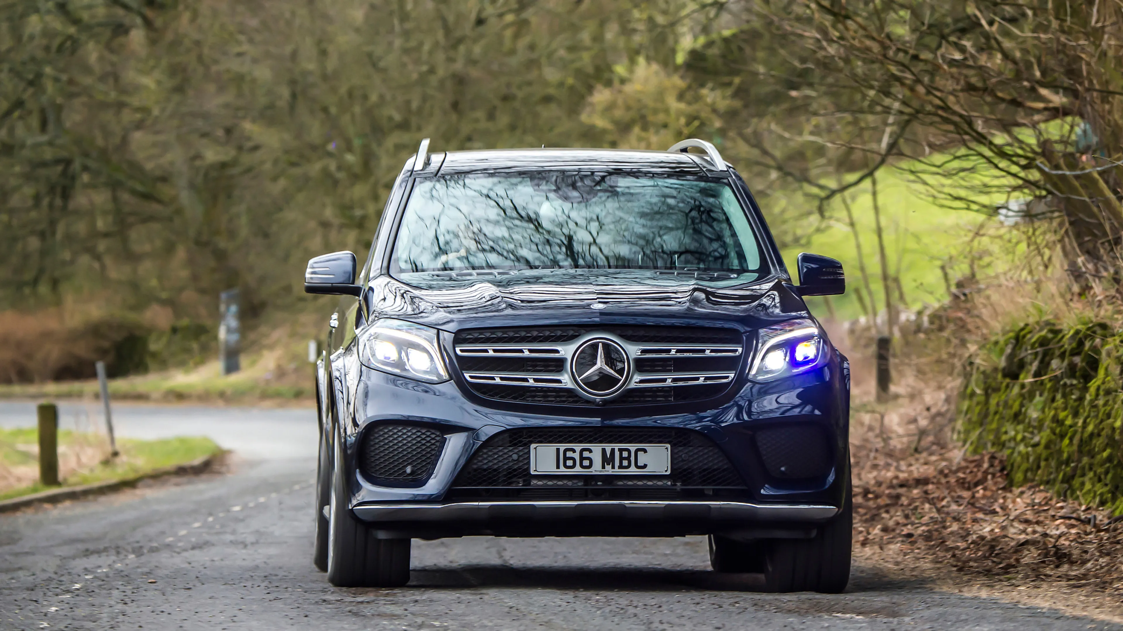 Front View of Black Mercedes Benz SUV on Country Road