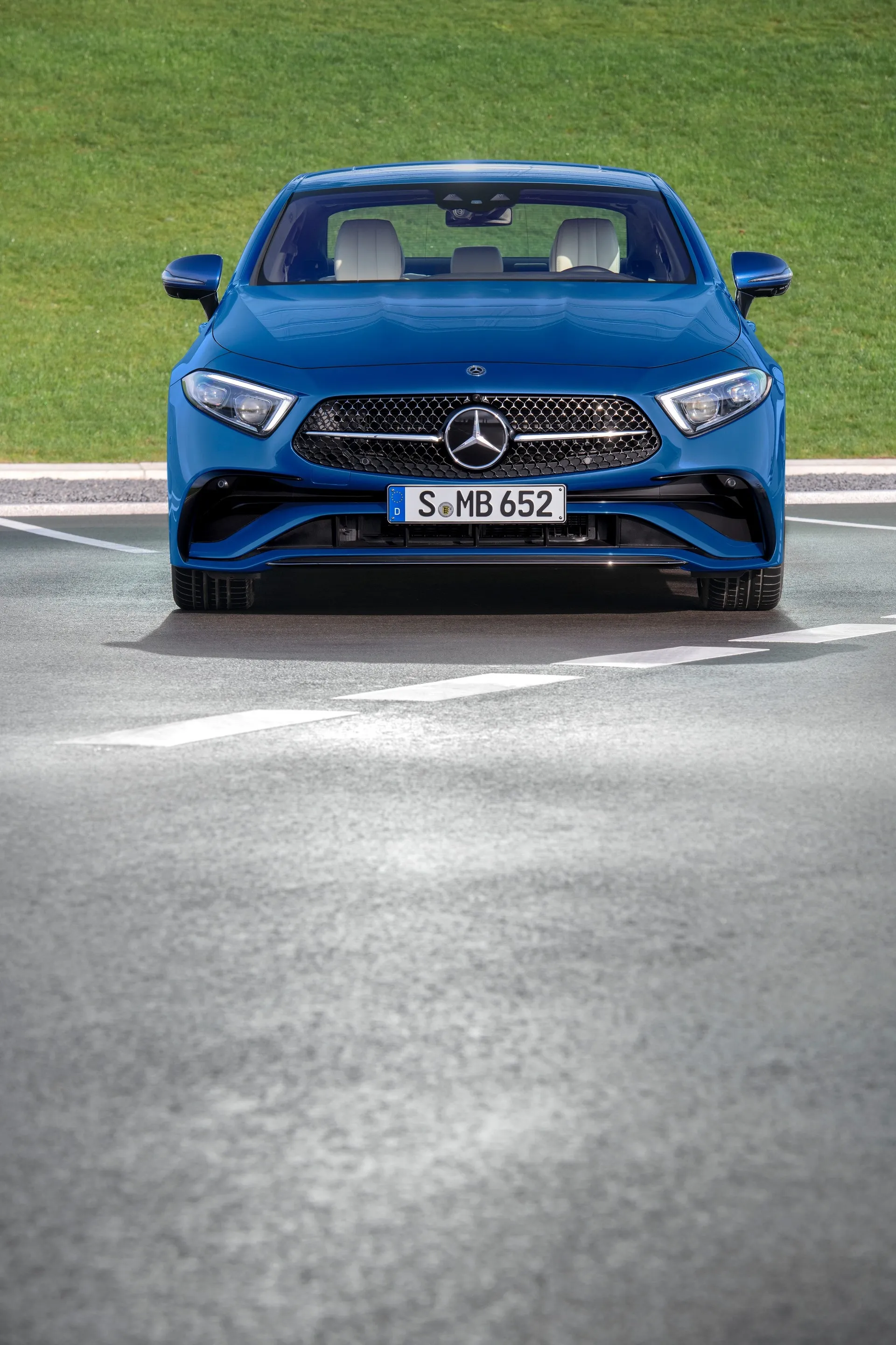 Front View of Blue Mercedes Benz on Clean Road HD image