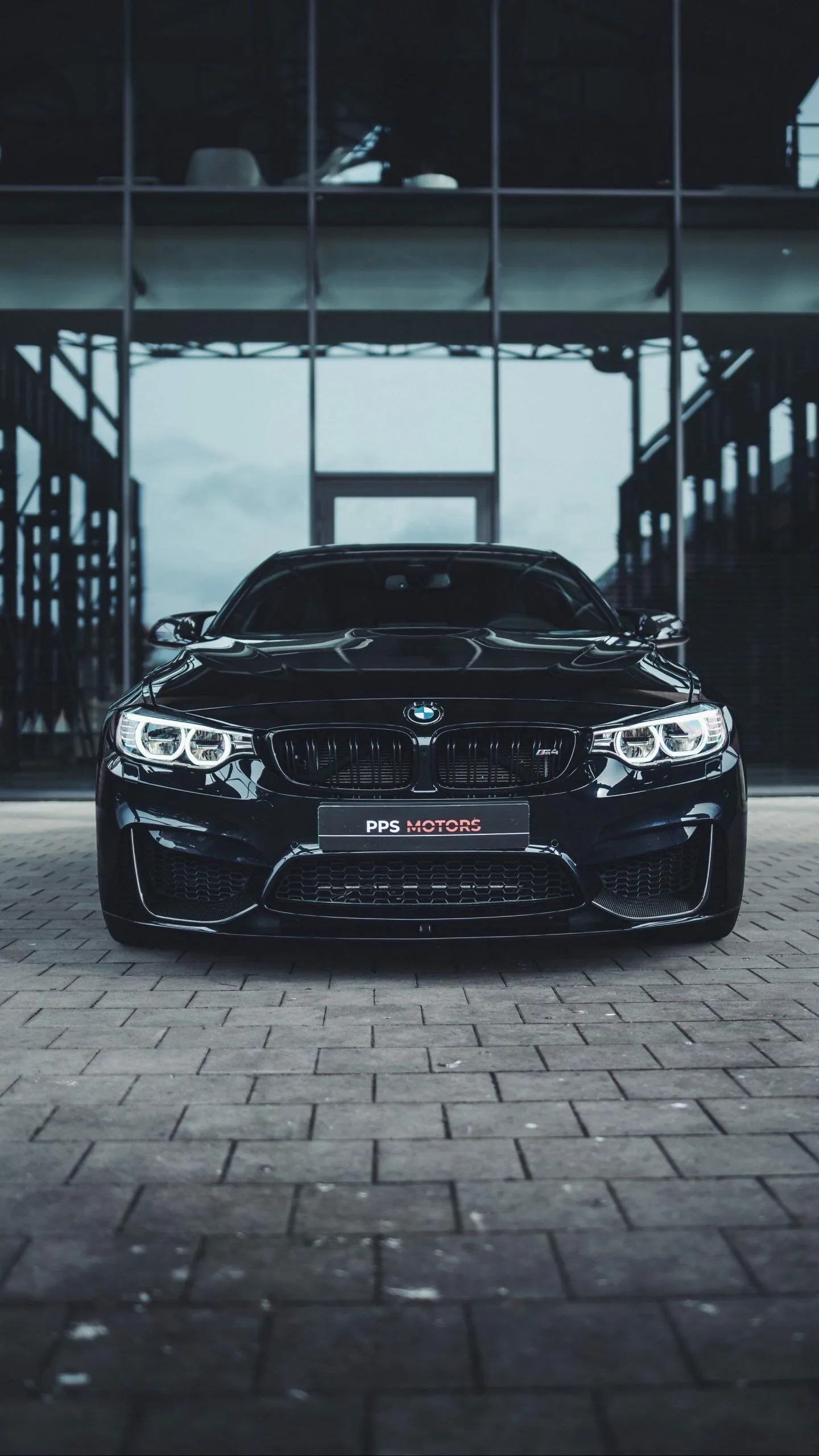 Front View of Bmw Sports Car Parked in Dark Modern Garage