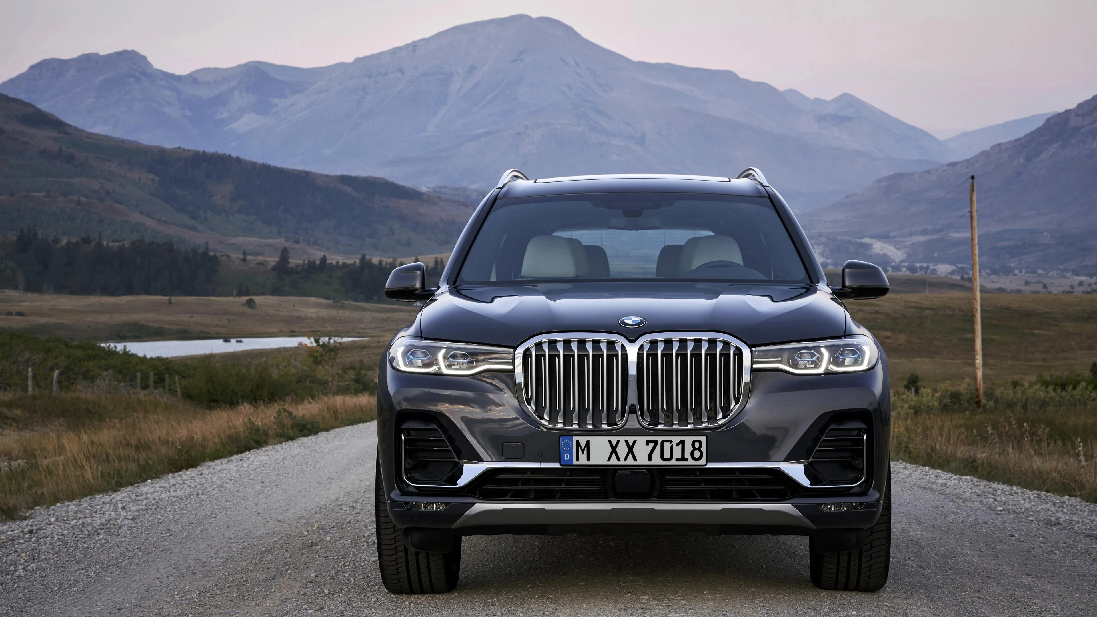 Front View of Bmw Suv Driving on Rural Highway Image