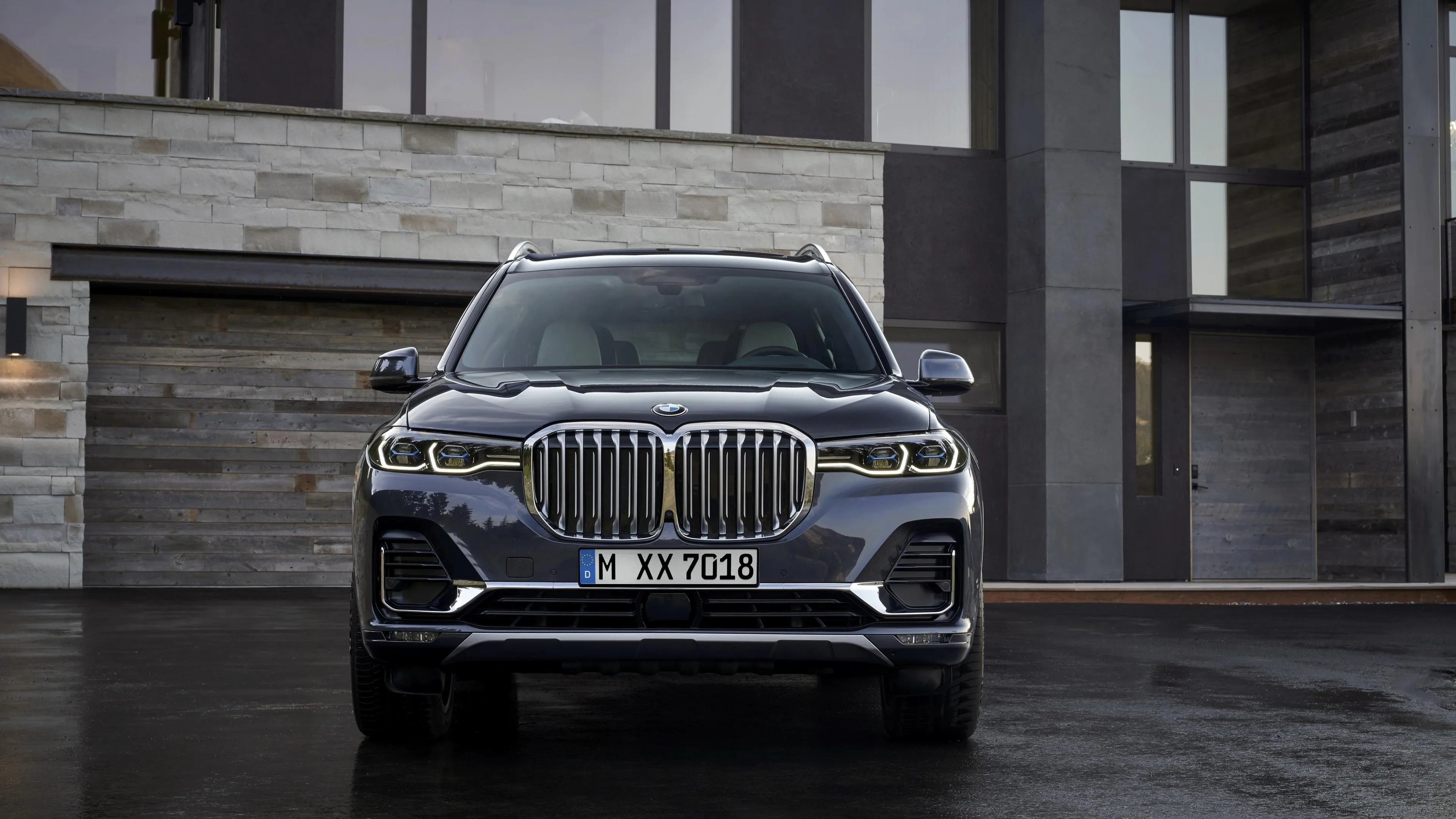 Front View of Bmw Suv in Front of a Luxury Building