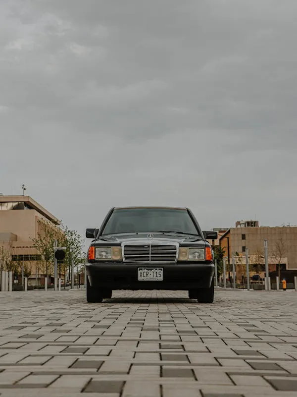 Front View of Classic Mercedes Benz on Pavement Wallpaper