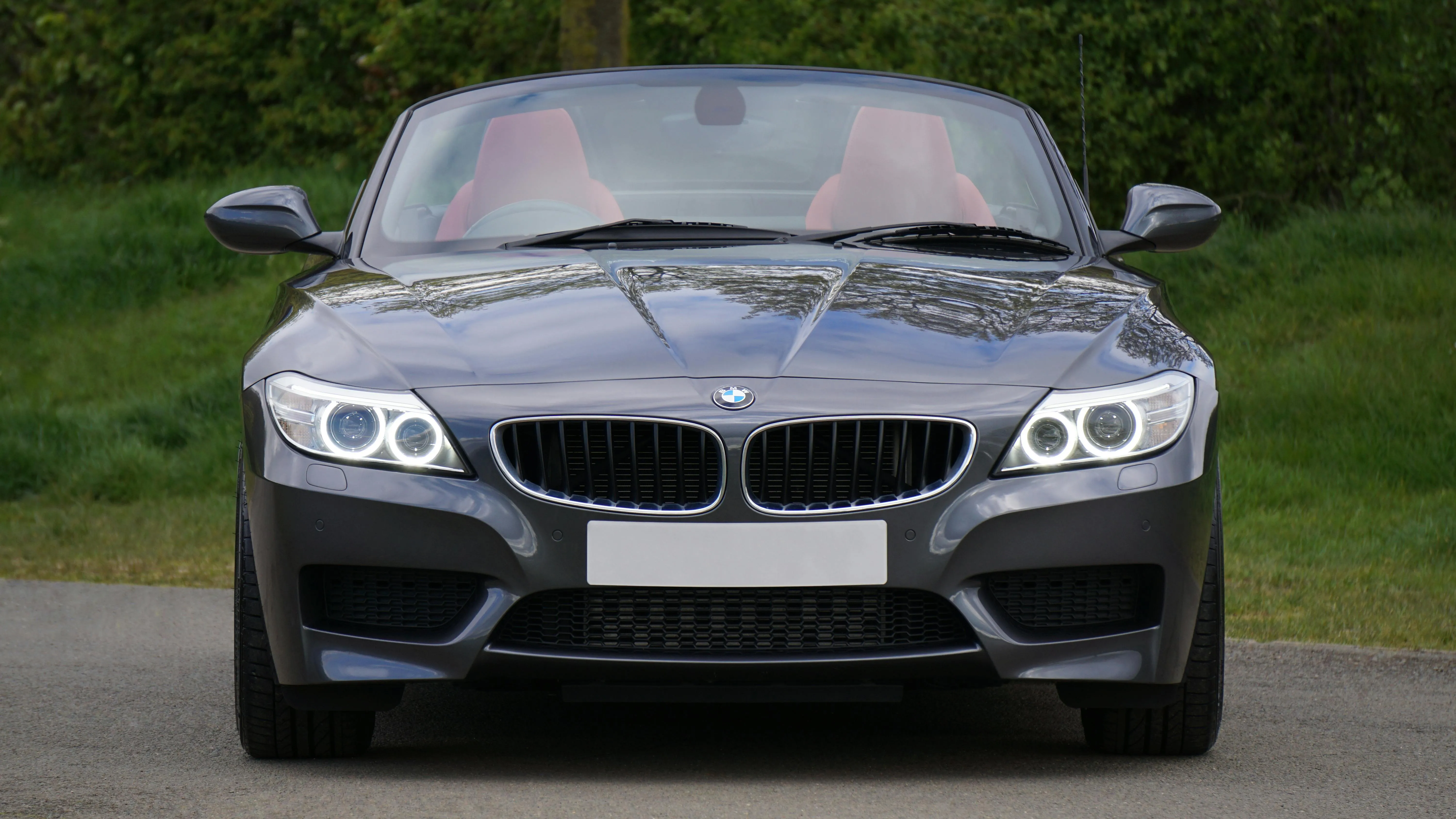 Front View of Grey Bmw Parked on Roadside Near Grass