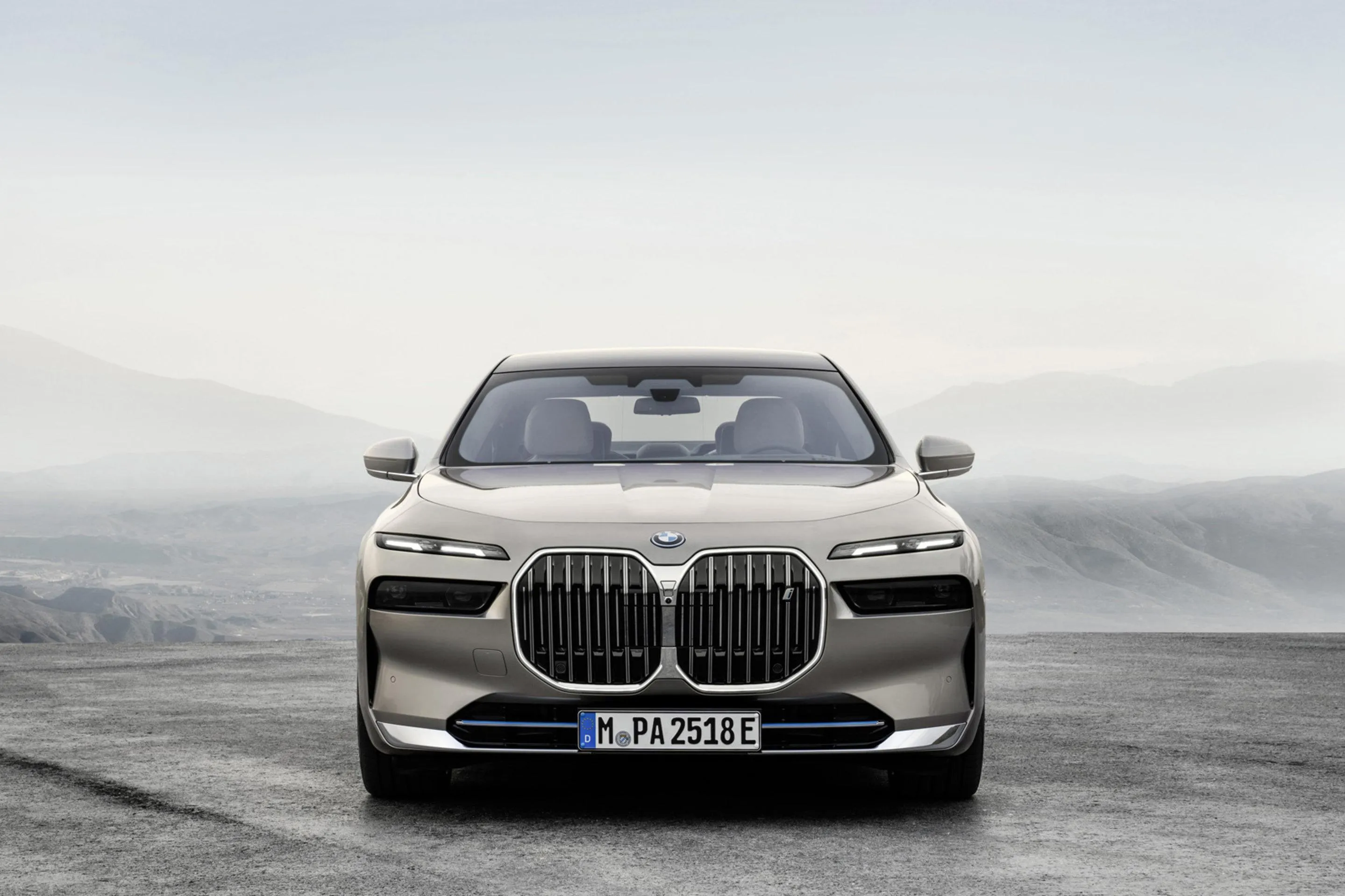 Front View of Luxury Bmw Sedan with Scenic Misty Landscape