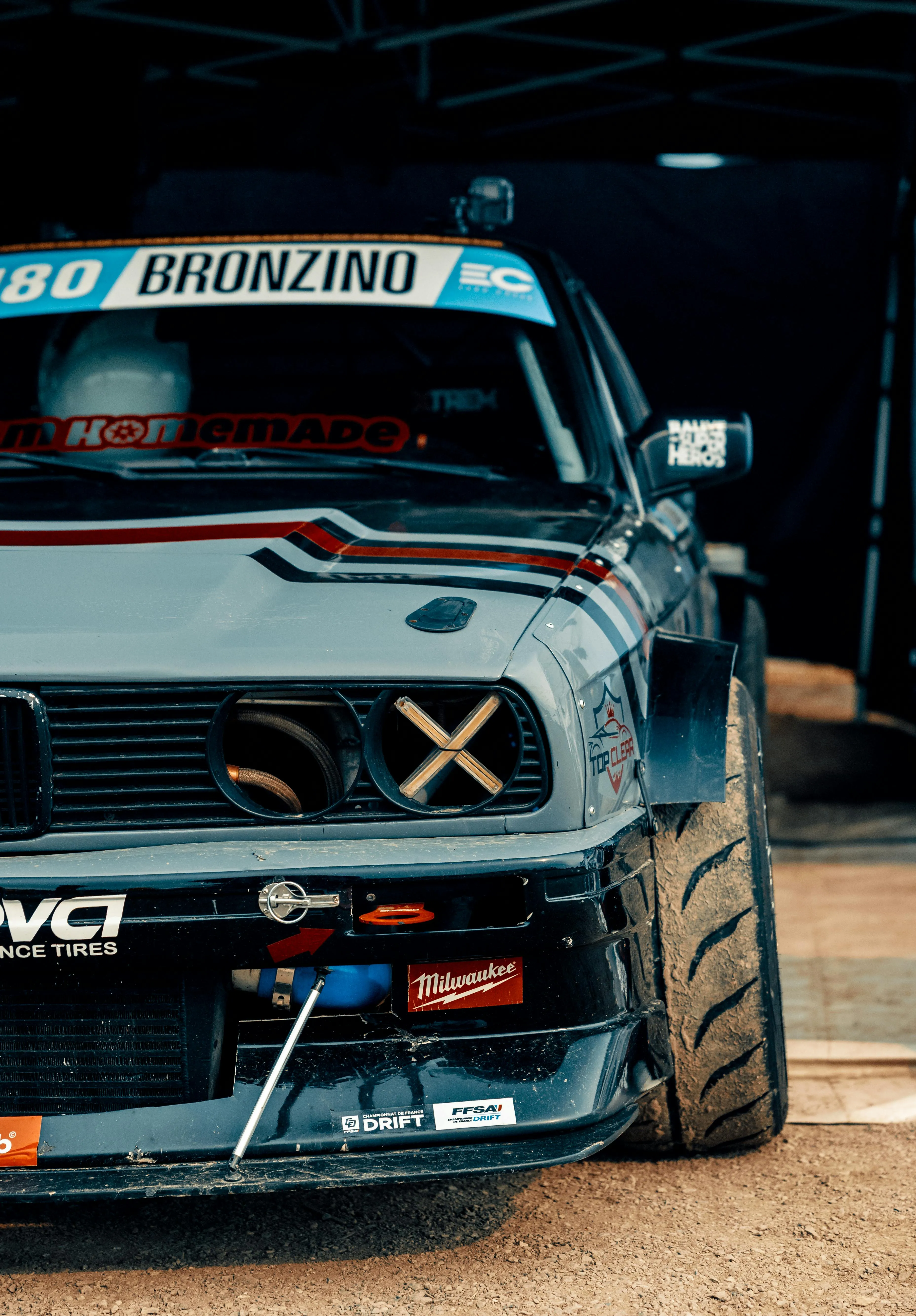 Front View of Modified Bmw Race Car in Dark Garage