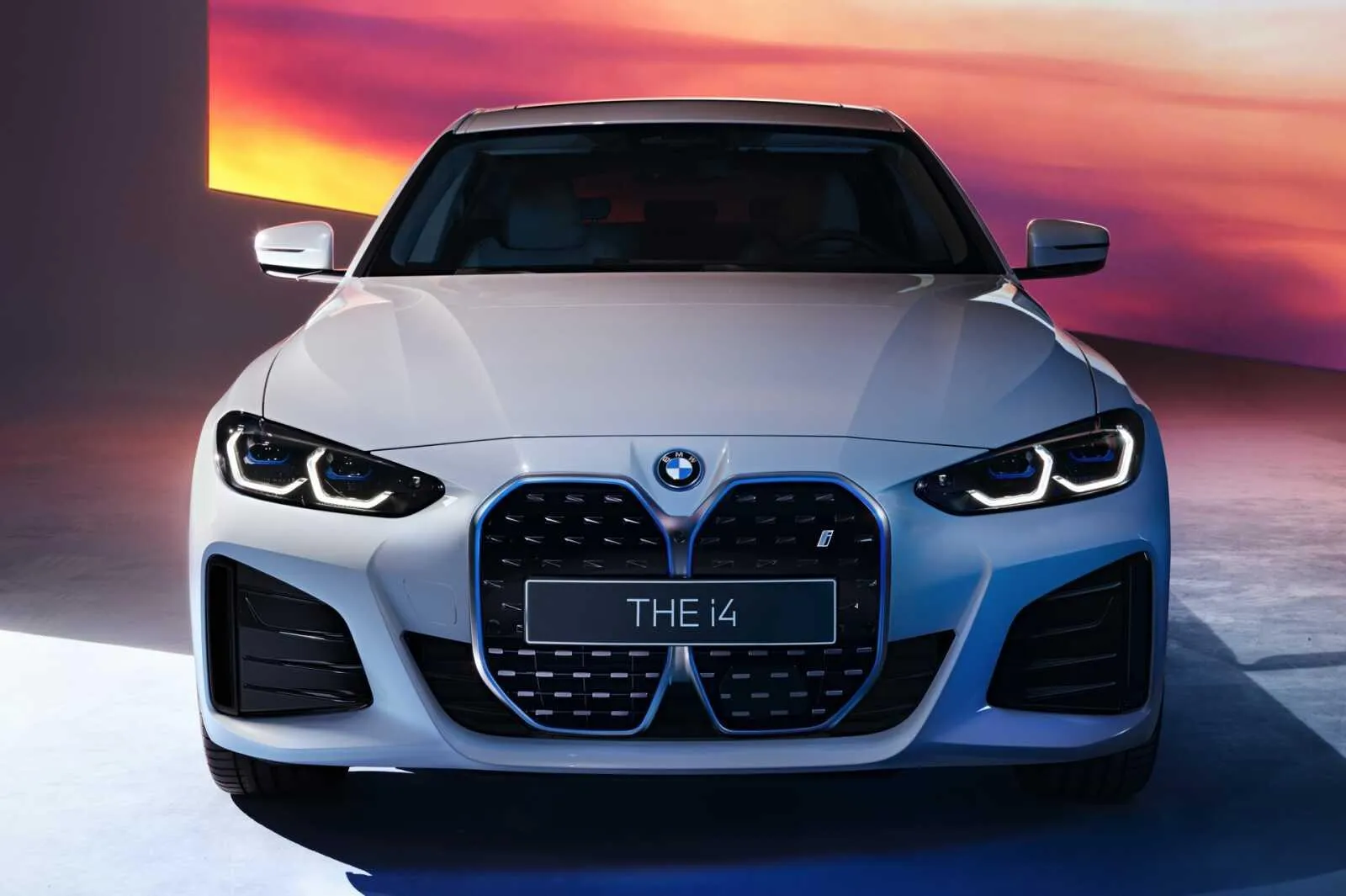 Front View of White Bmw with Sunset in the Background