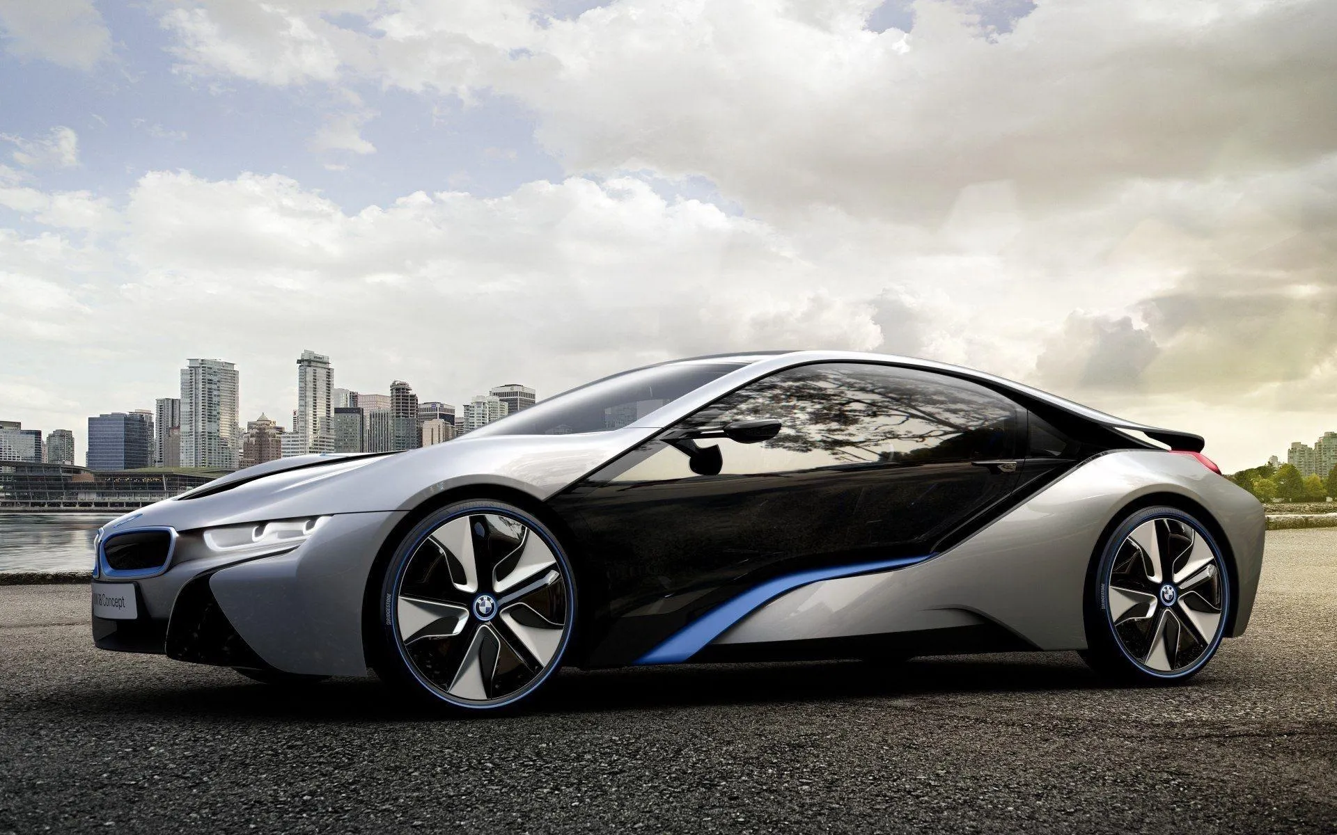 Futuristic Bmw Sports Car Parked By City Skyline Image