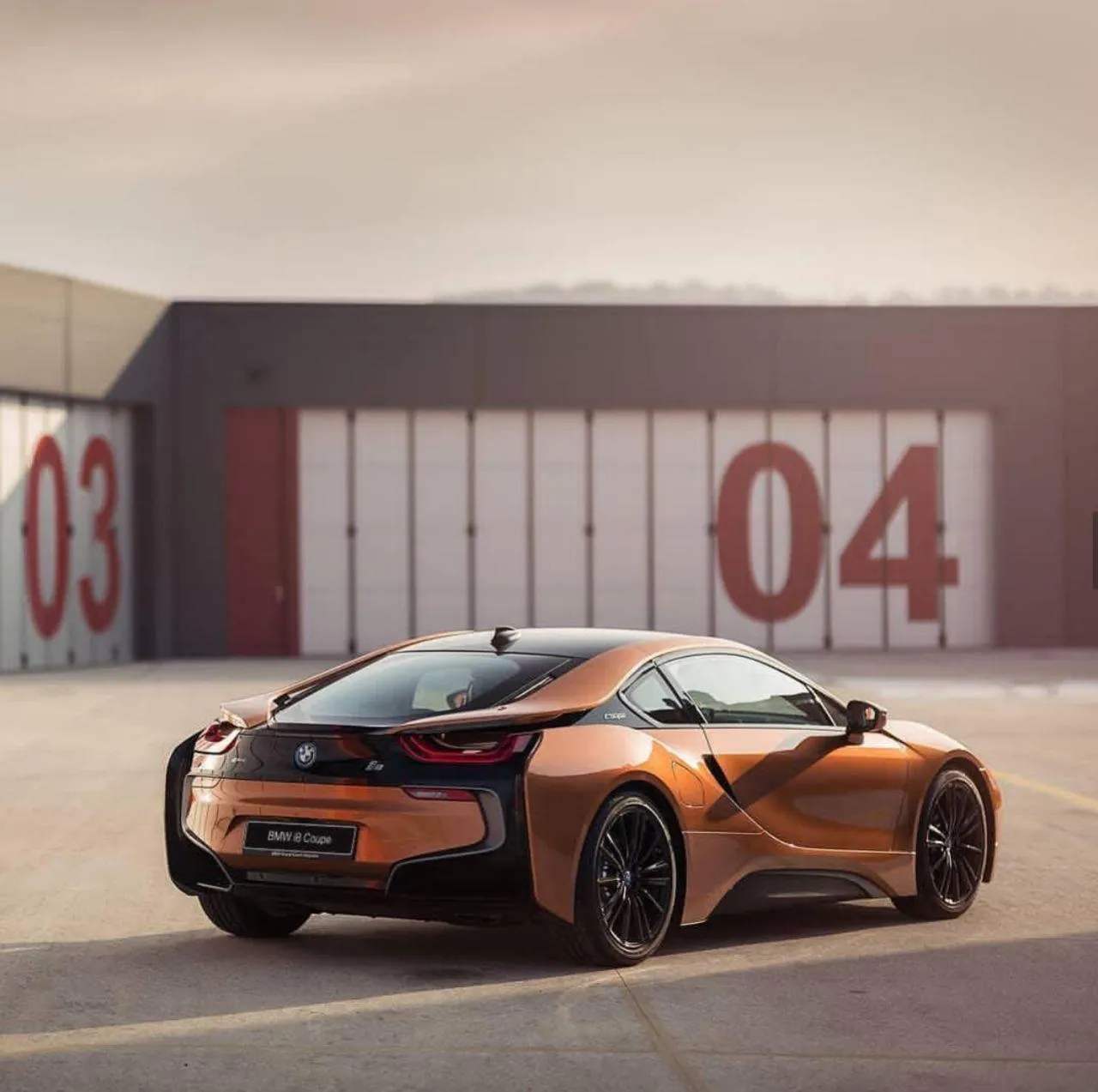 Futuristic Orange Bmw Sports Car on a Race Track Image