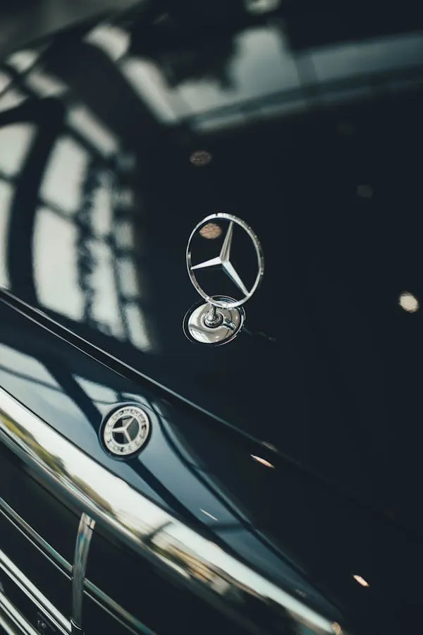 Glossy Black Mercedes Benz Hood with Logo Badge Wallpaper