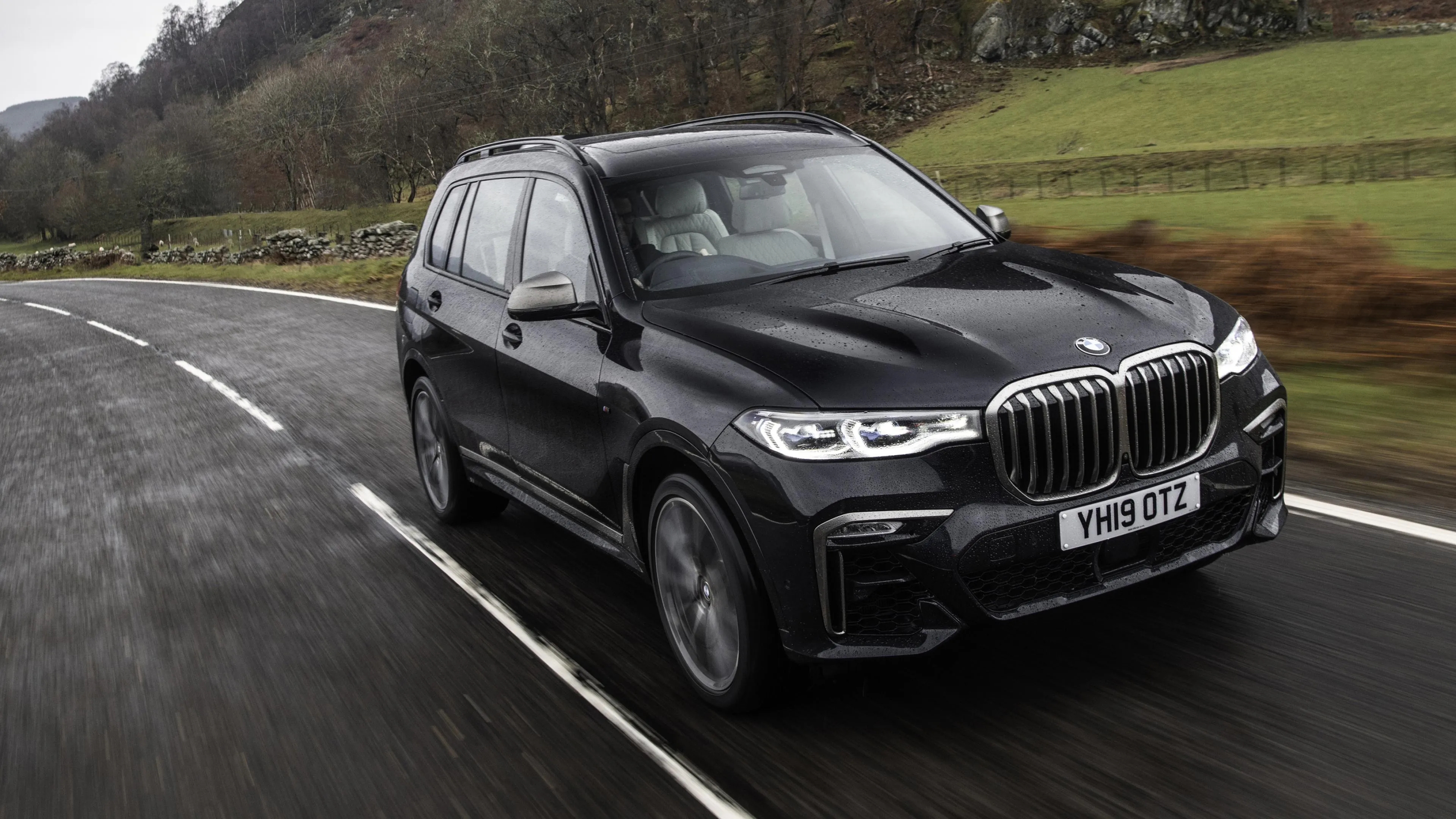 Gray Bmw Wagon Driving Through Countryside on Rainy Road