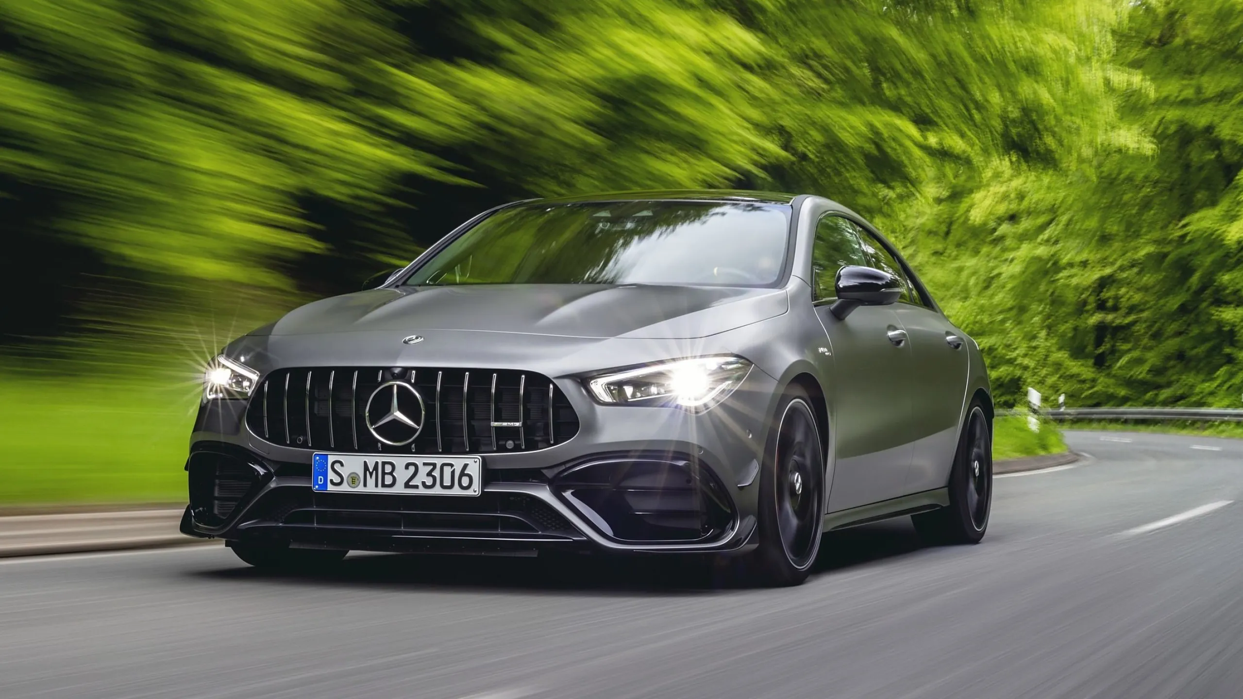 Gray Mercedes Benz Car Driving Fast on Forest Road Wallpaper
