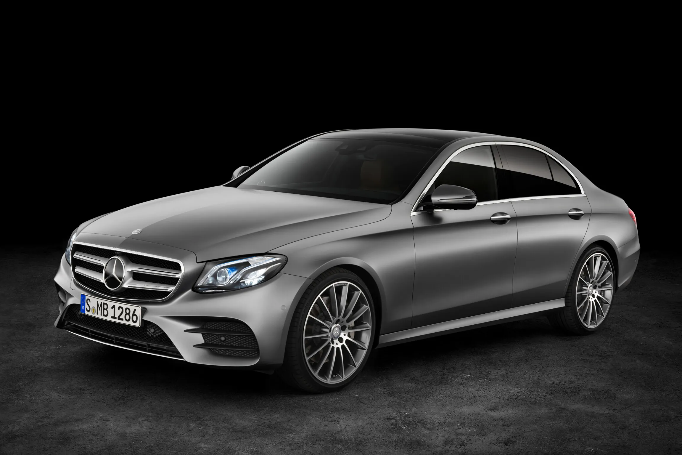 Gray Mercedes Benz coupe isolated on a black background