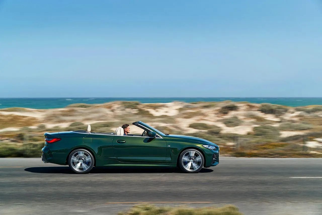 Green Bmw Convertible Driving on Coastal Scenic Road