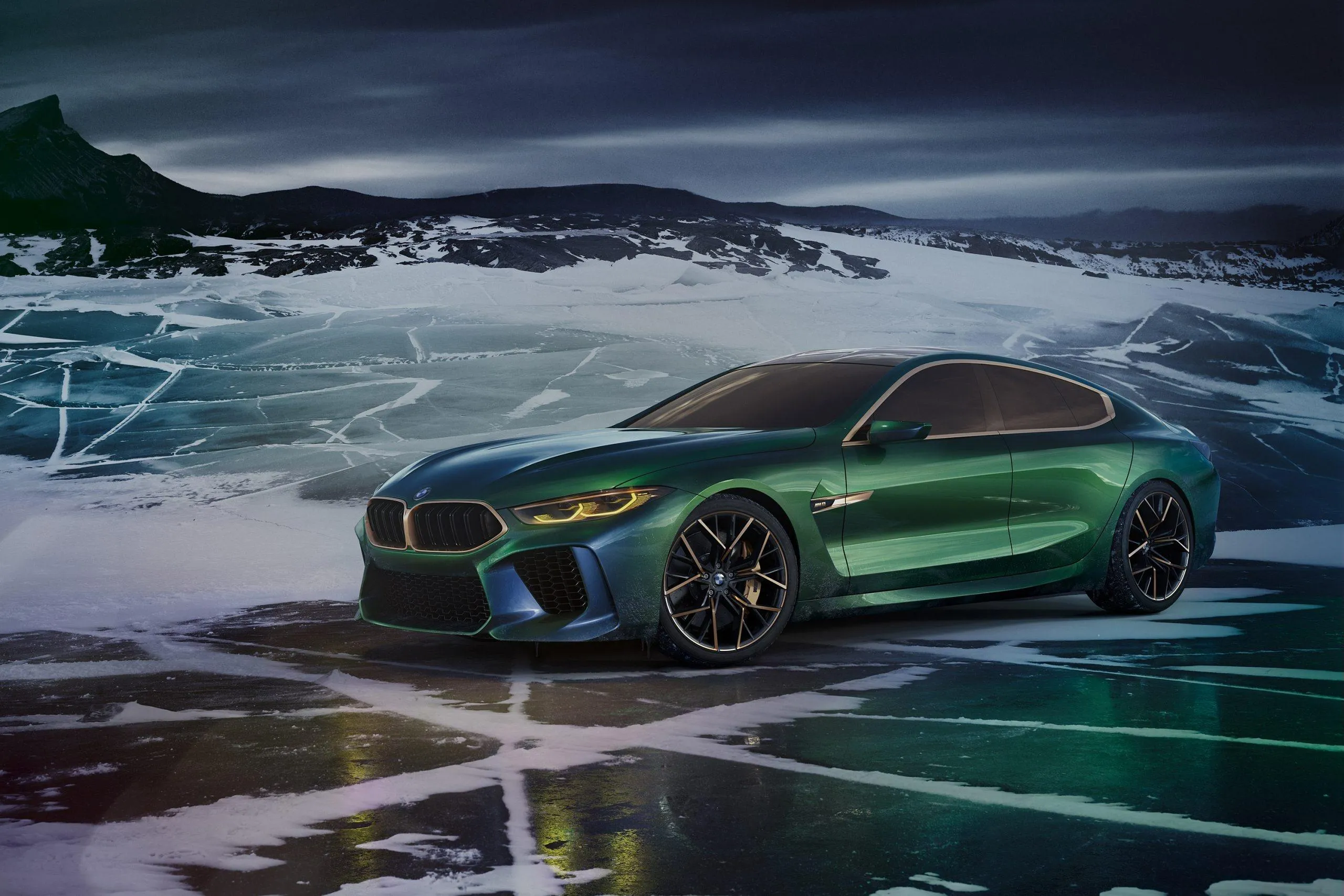 Green Bmw Parked on Icy Frozen Lake at Sunset Wallpaper