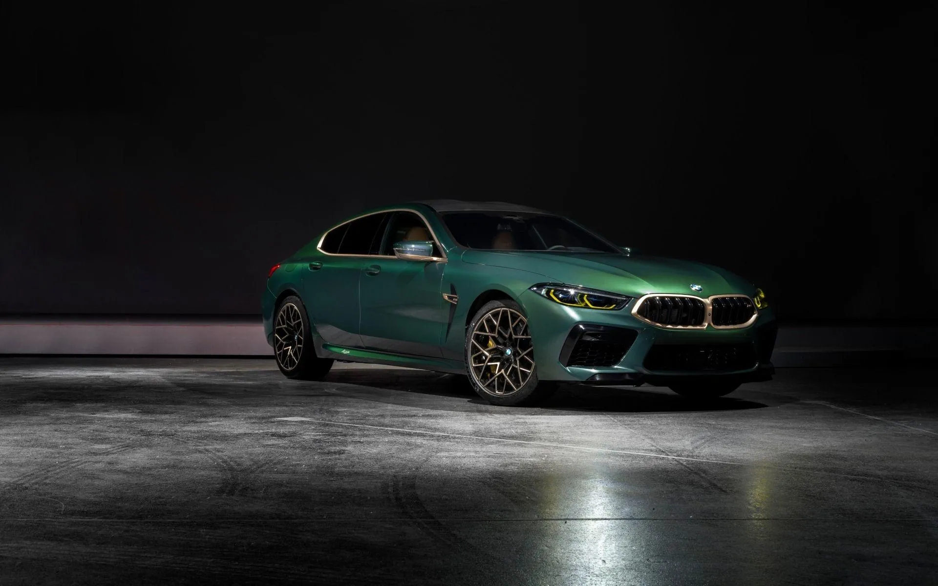 Green Bmw Sports Car Illuminated By Soft Indoor Lighting