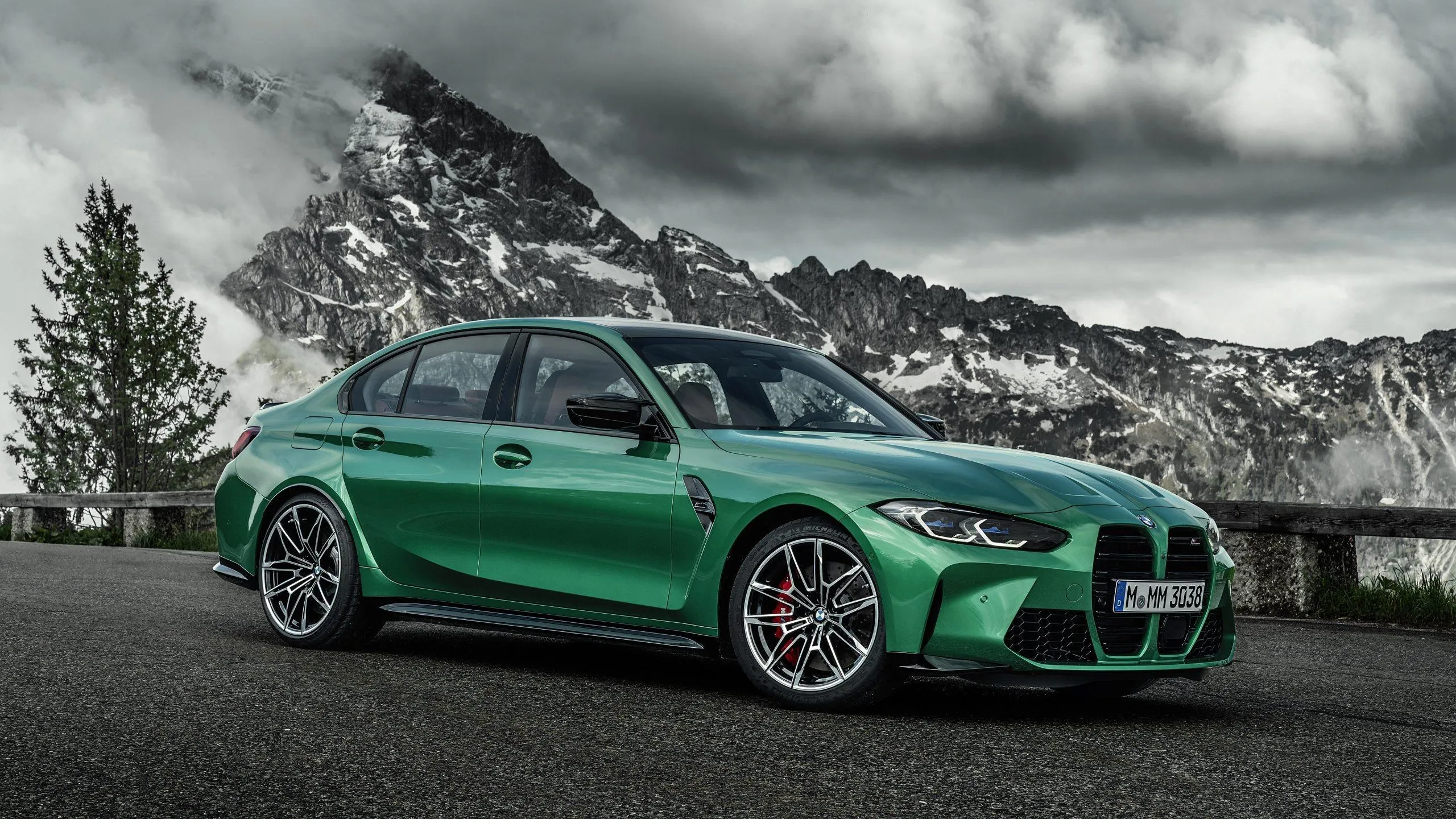 Green Bmw Sports Car Parked with Snowy Mountain View