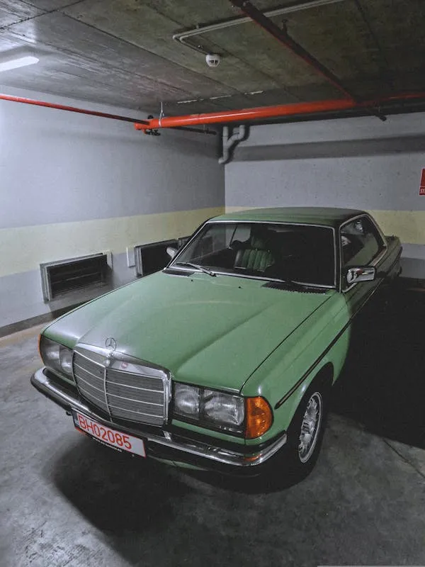 Green Classic Mercedes Benz Parked in Basement Garage