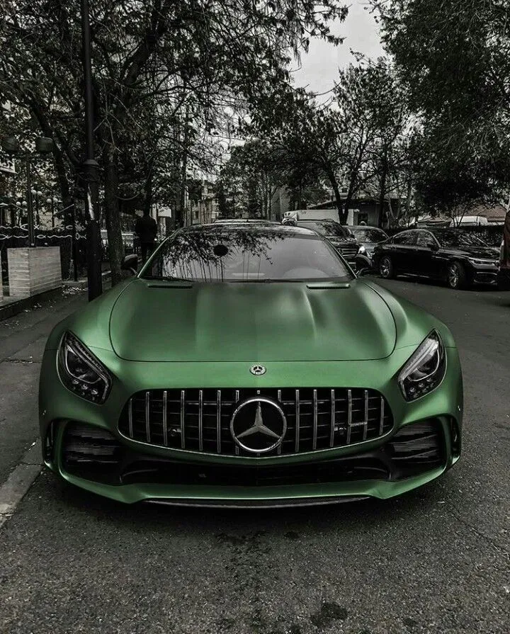 Green Mercedes AMG Parked in Outdoor Urban Environment