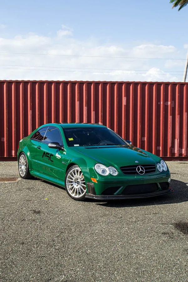 Green Mercedes Benz Sports Car Near Shipping Container