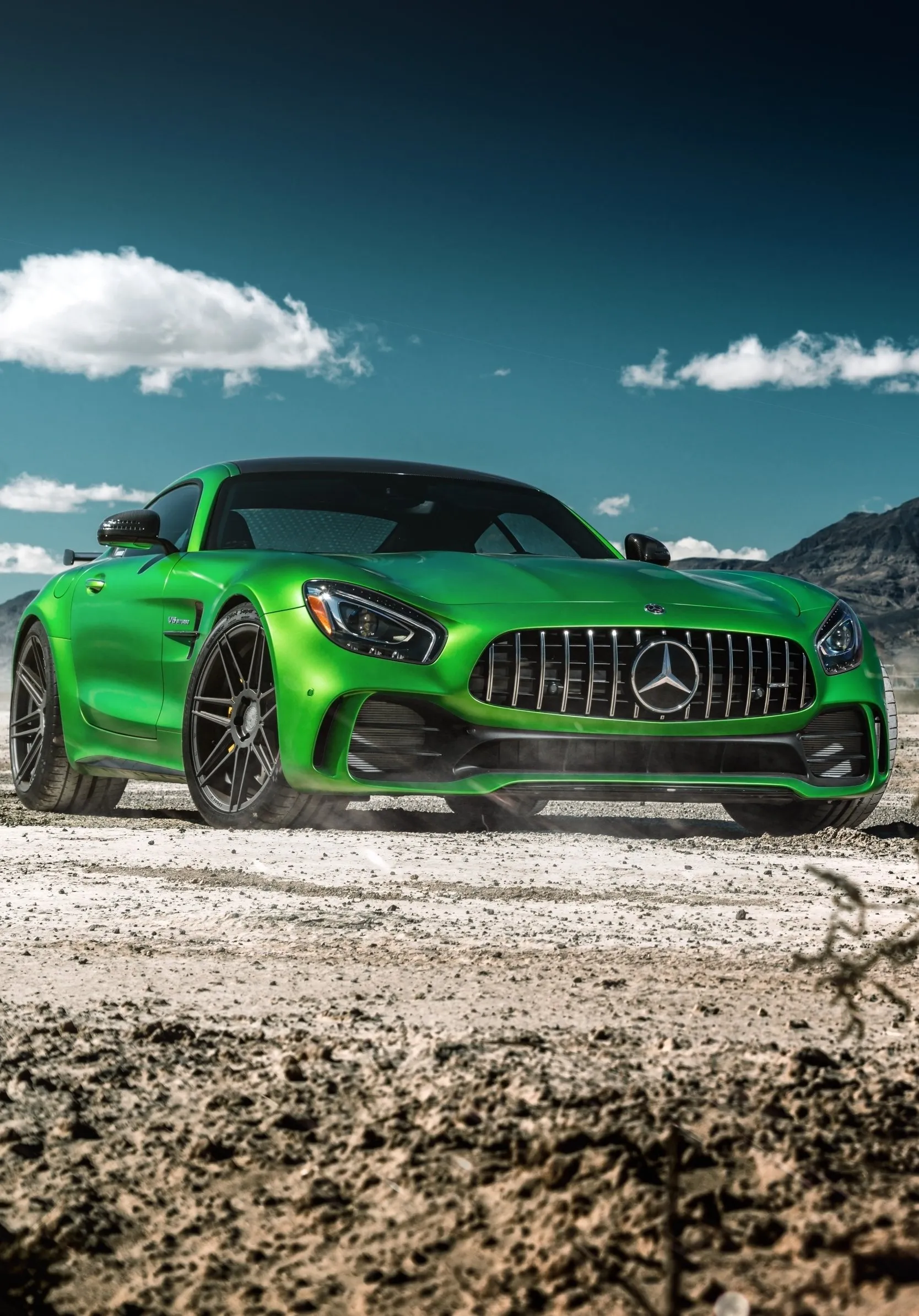Green Mercedes Benz Sports Car Parked Outdoors on Gravel Road
