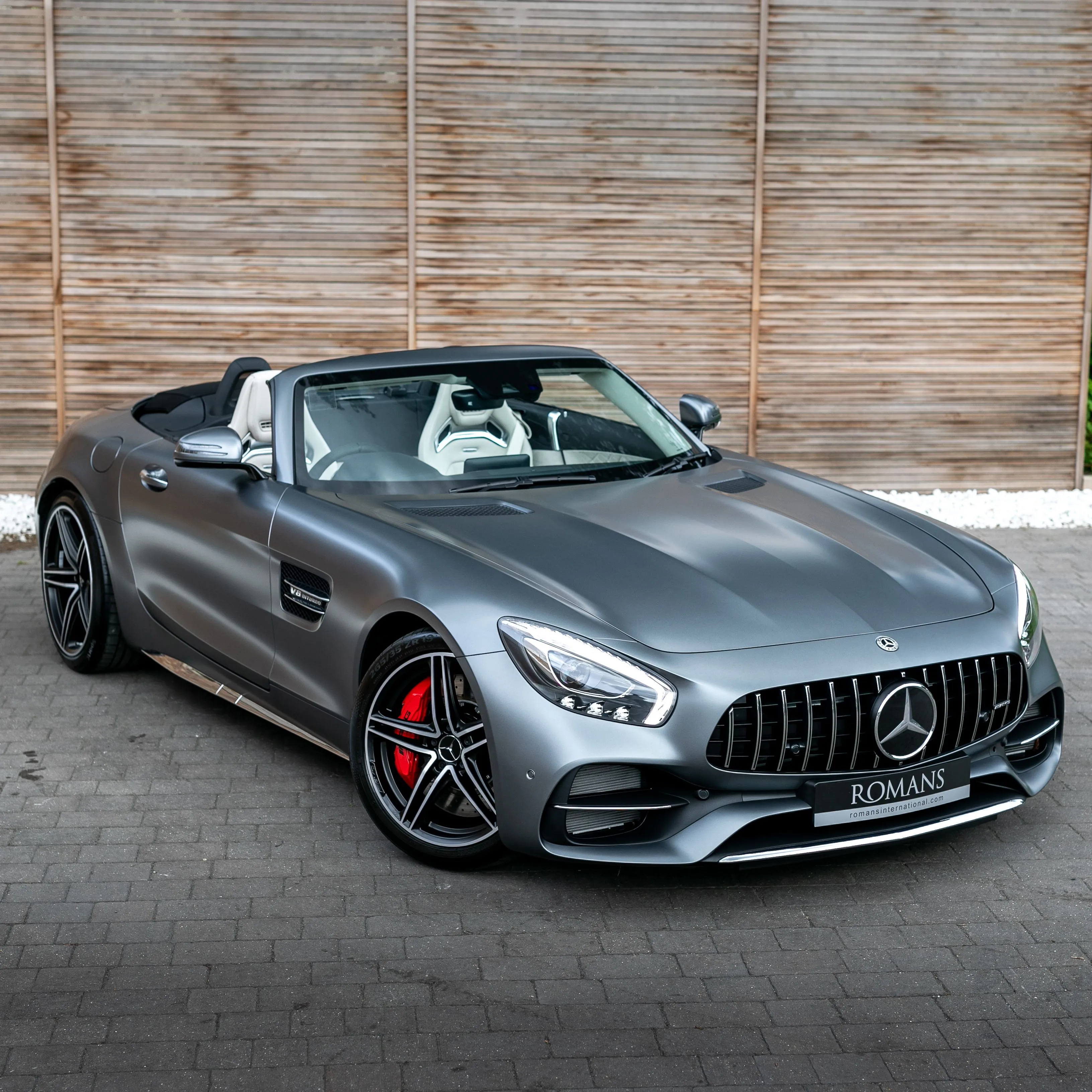 Grey Mercedes Benz Convertible Parked by Wooden Wall