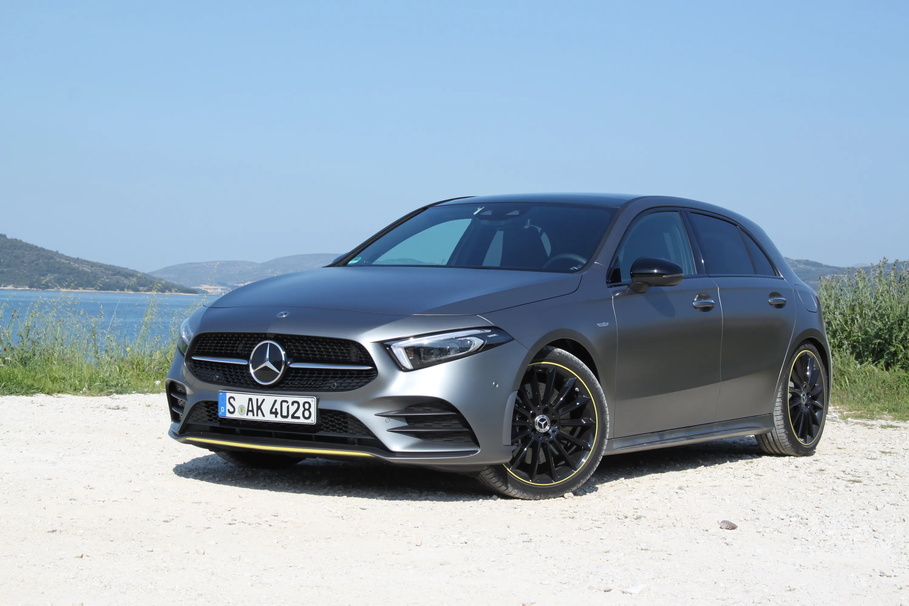 Grey Mercedes Compact Car Parked in Open Countryside