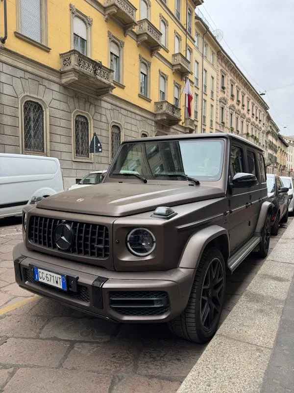 Grey Mercedes G Wagon on Cobblestone City Road Wallpaper