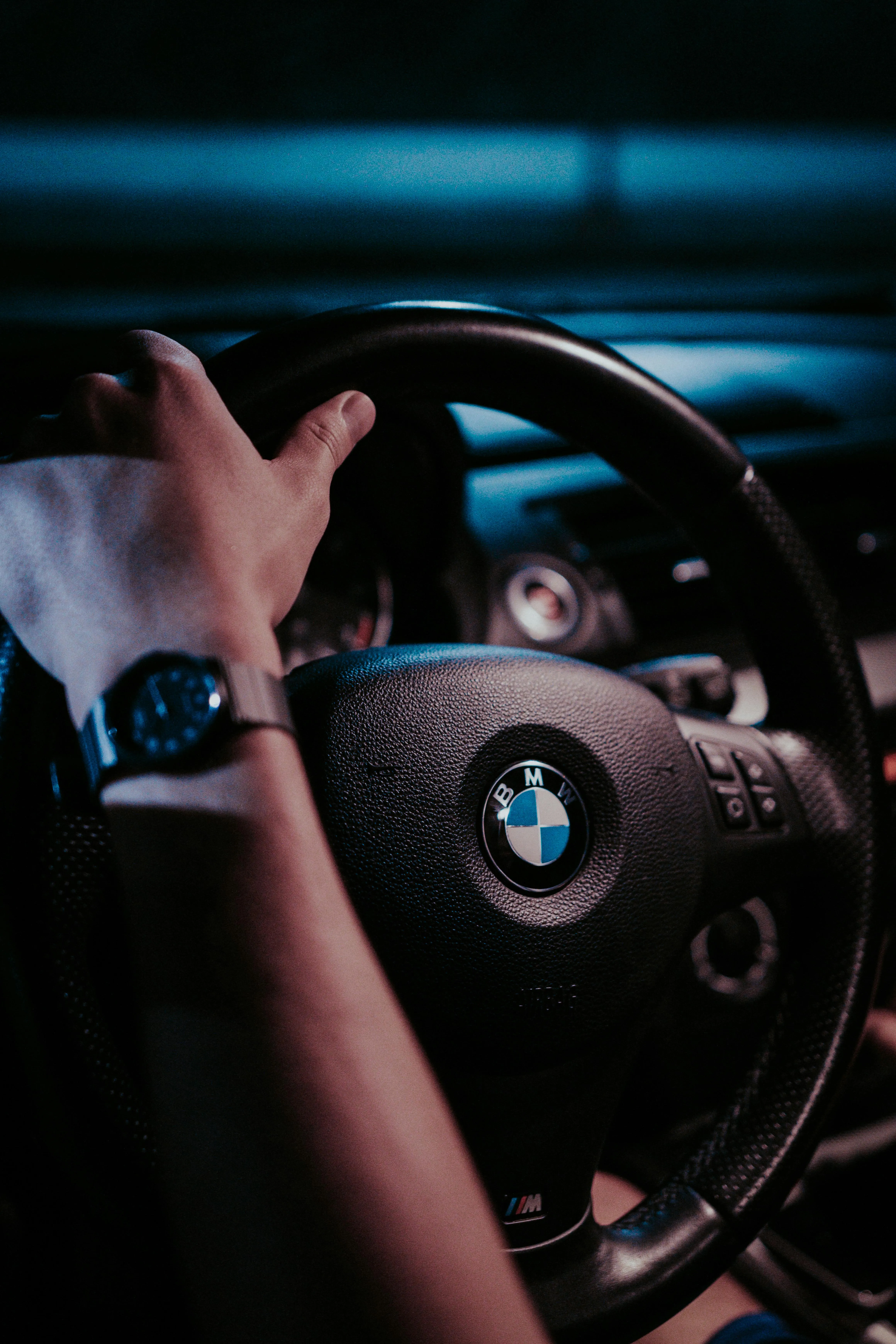 Hands on Bmw Steering Wheel in a Night Driving Scene