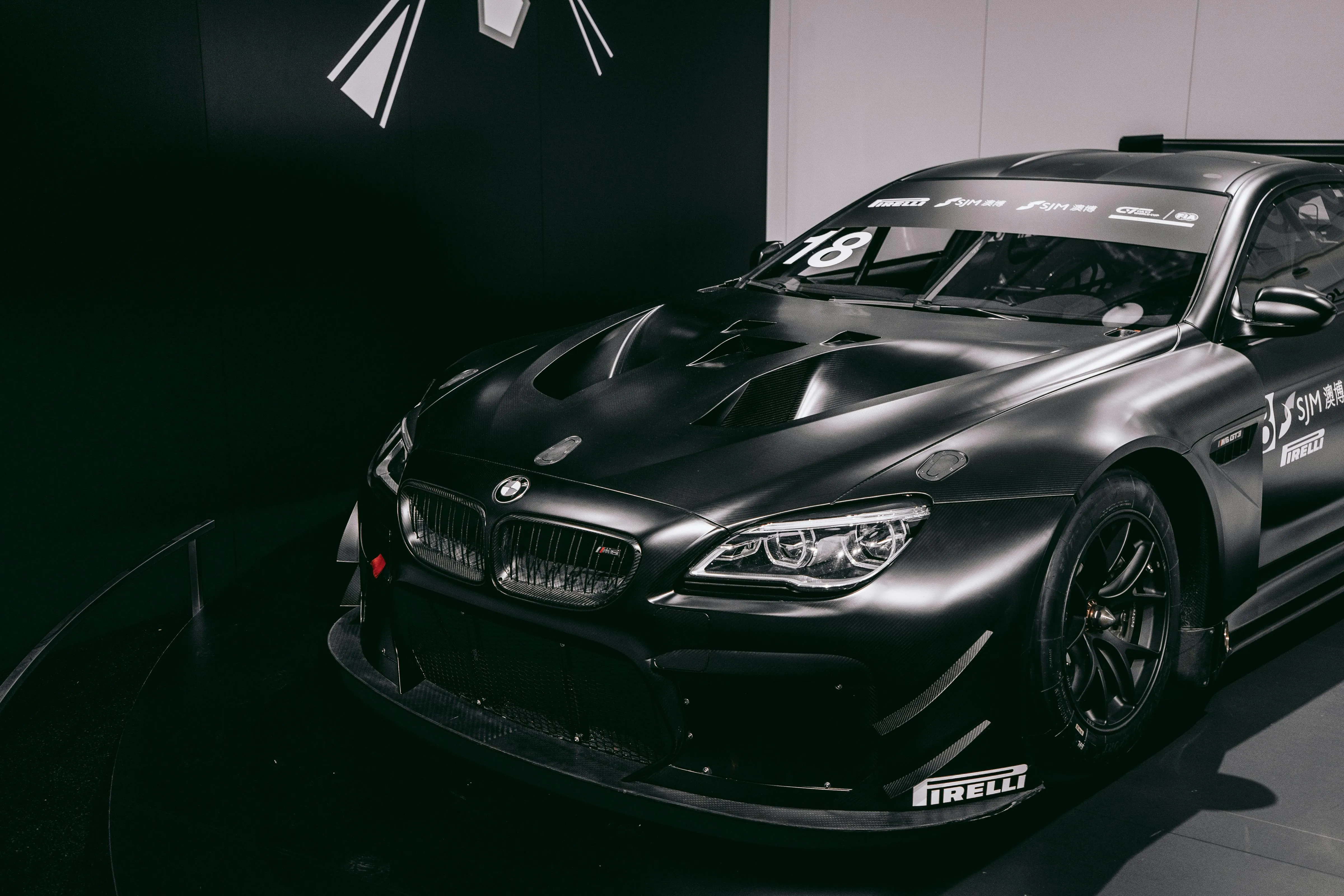 High Performance Racing Bmw Displayed in a Modern Showroom