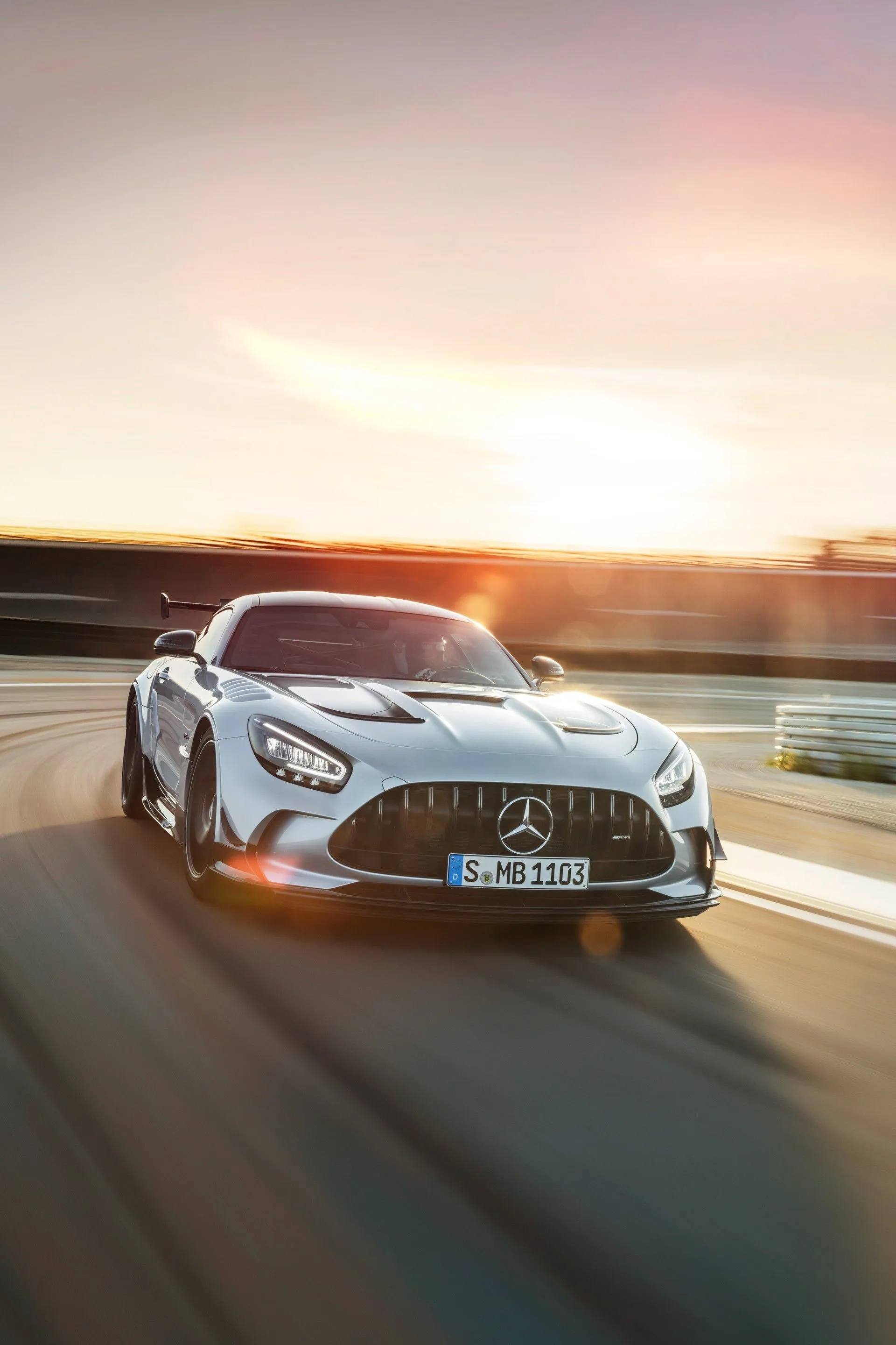 High Speed Mercedes Captured During Golden Sunset Wallpaper