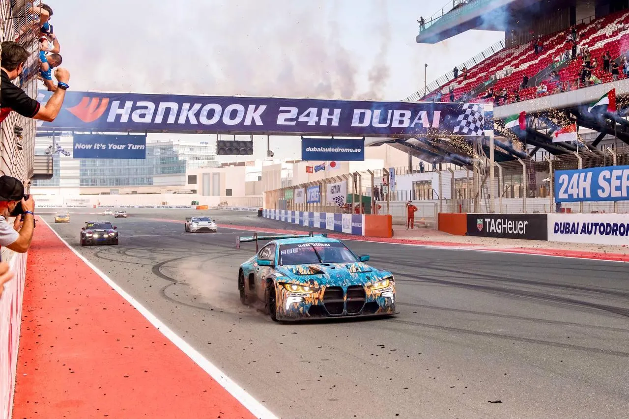 High Speed Racing Car on the Track in Dubai Race Wallpaper