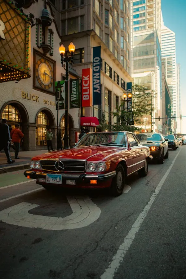 Iconic Benz Cruising Through Downtown City Street Wallpaper