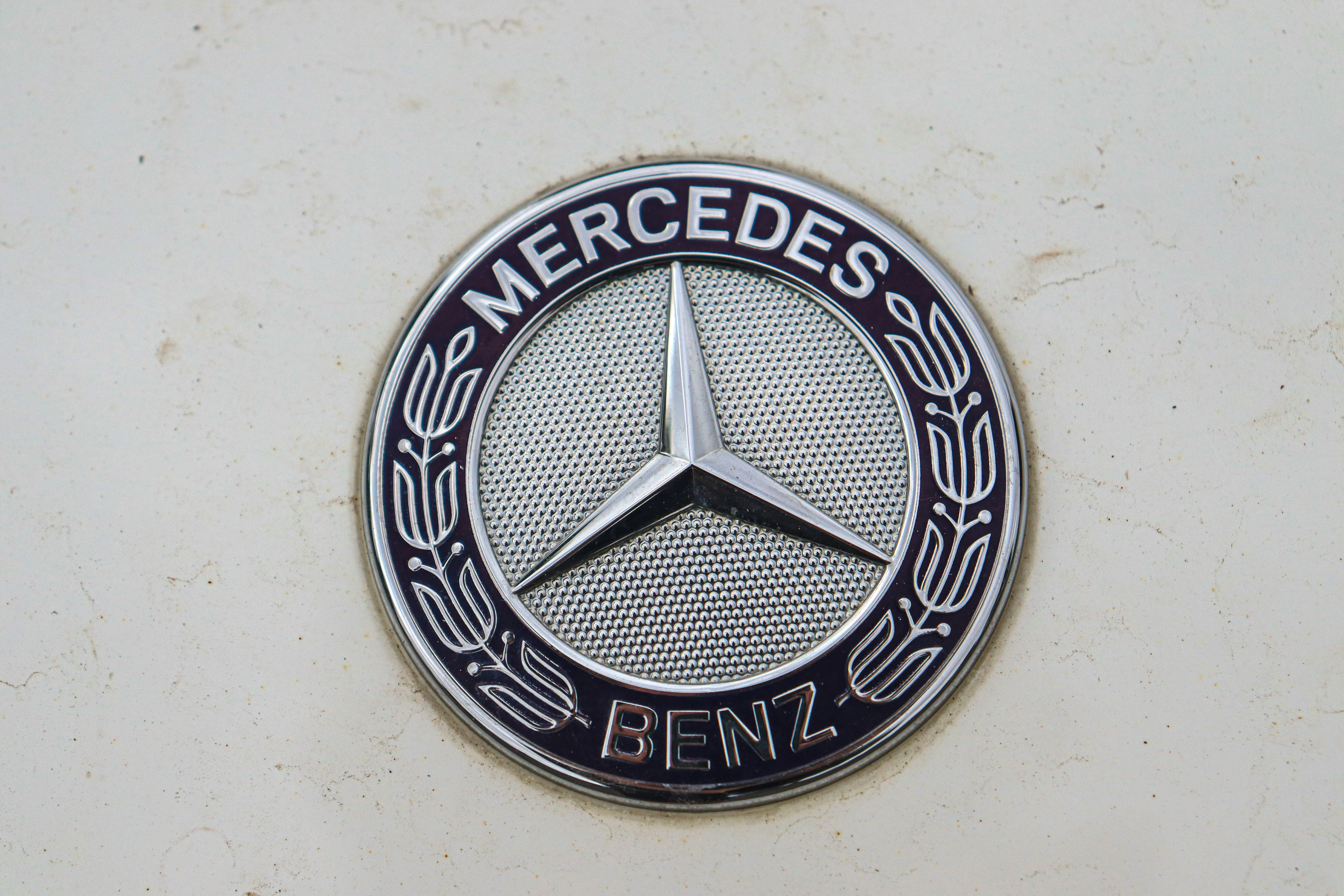 Iconic Mercedes Benz Emblem Close Up on a Clean Background