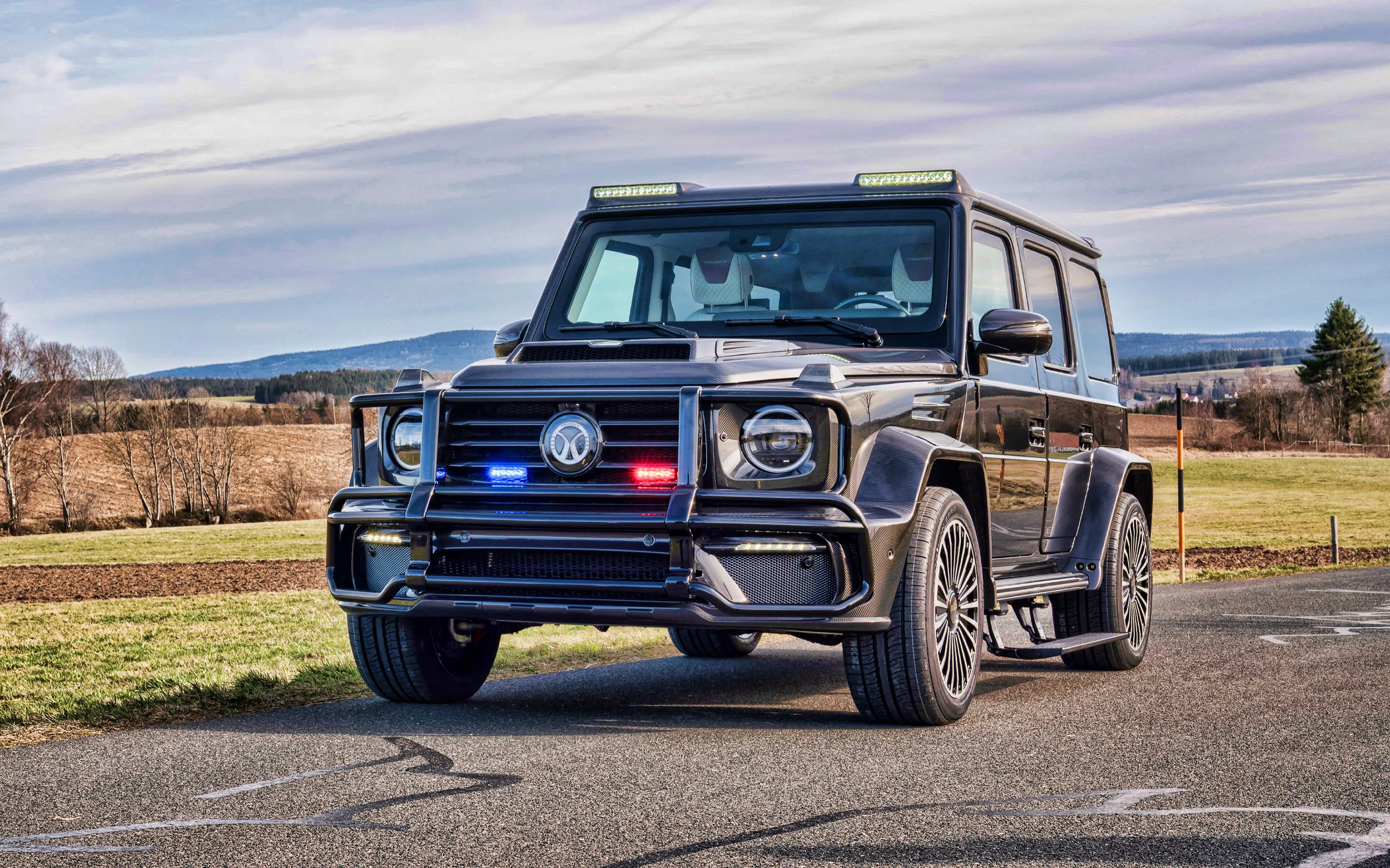 Iconic Mercedes G Wagon on Rugged Countryside Drive image